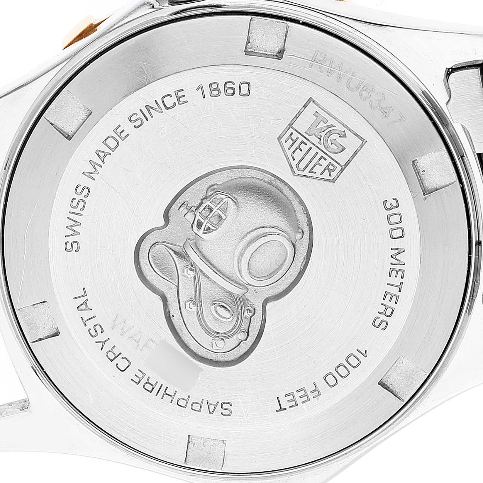 The image shows the back case of the Tag Heuer Aquaracer WAF1450.BA0825 Women's Steel and Gold (two tone) Mother of Pearl Dial WAF1450.BA0825 Women's Steel and Gold (two tone) Mother of Pearl Dial watch, highlighting its engraving and water resistance specifications.