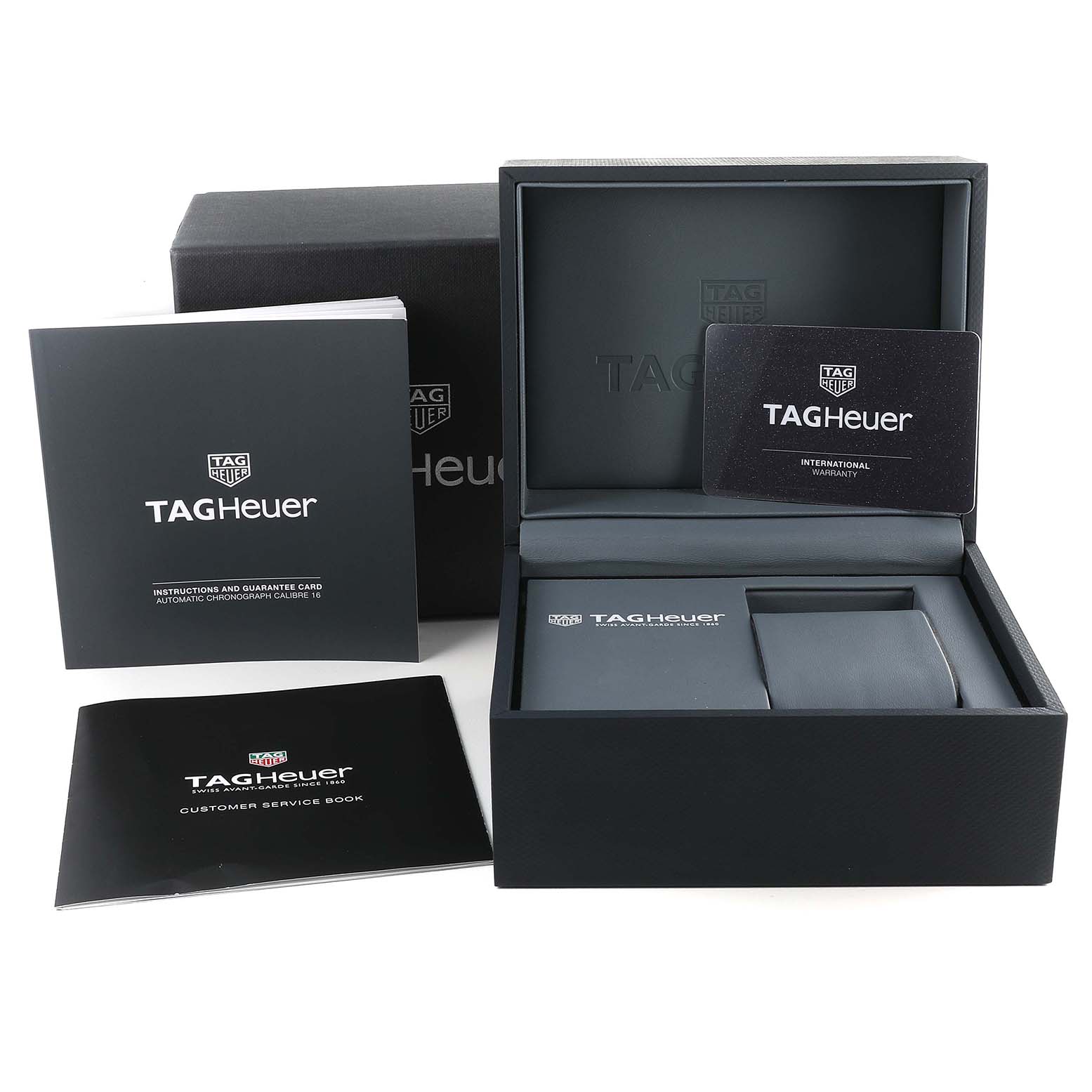 The image shows the box and manuals for a Tag Heuer Carrera CV2A1AB.FC6379 Men's Stainless Steel Black Dial CV2A1AB.FC6379 Men's Stainless Steel Black Dial watch, including warranty cards and instruction booklets.