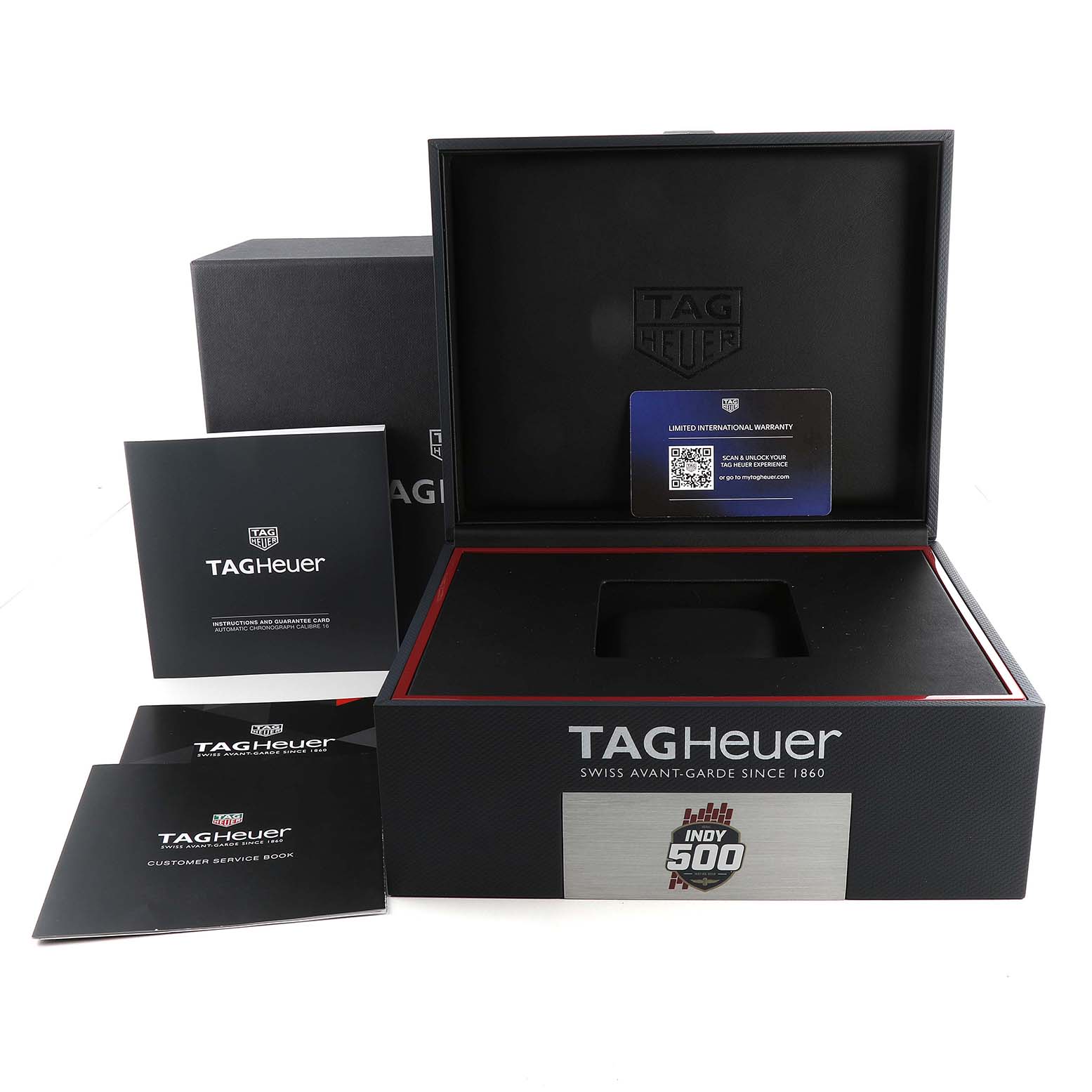 The image shows the open packaging box and documentation booklets for the Tag Heuer Indy 500 Limited Edition model.