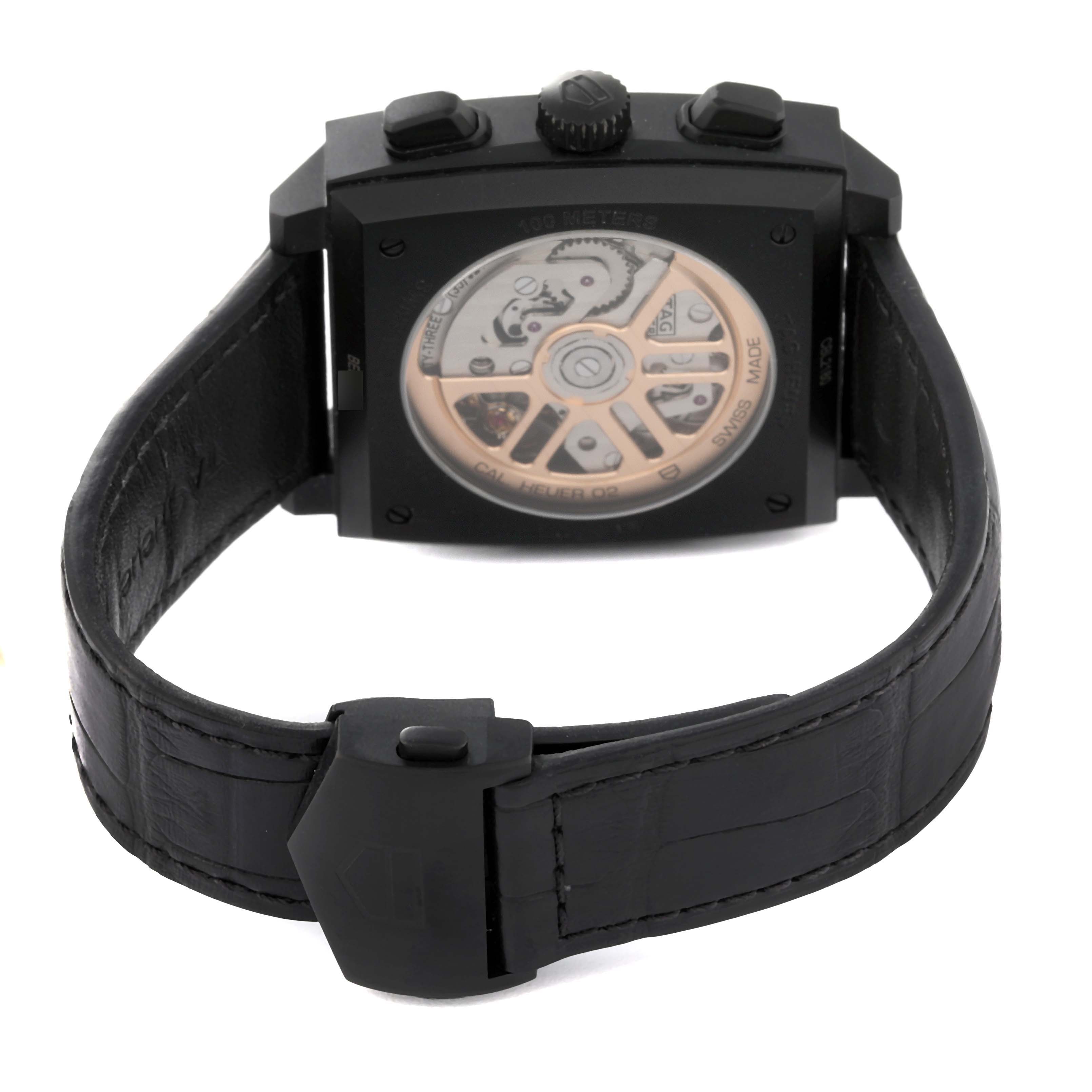 The image shows the back view of a Tag Heuer Monaco CBL2180 Men's Titanium Black Dial CBL2180 Men's Titanium Black Dial watch, highlighting its automatic movement and black leather strap.