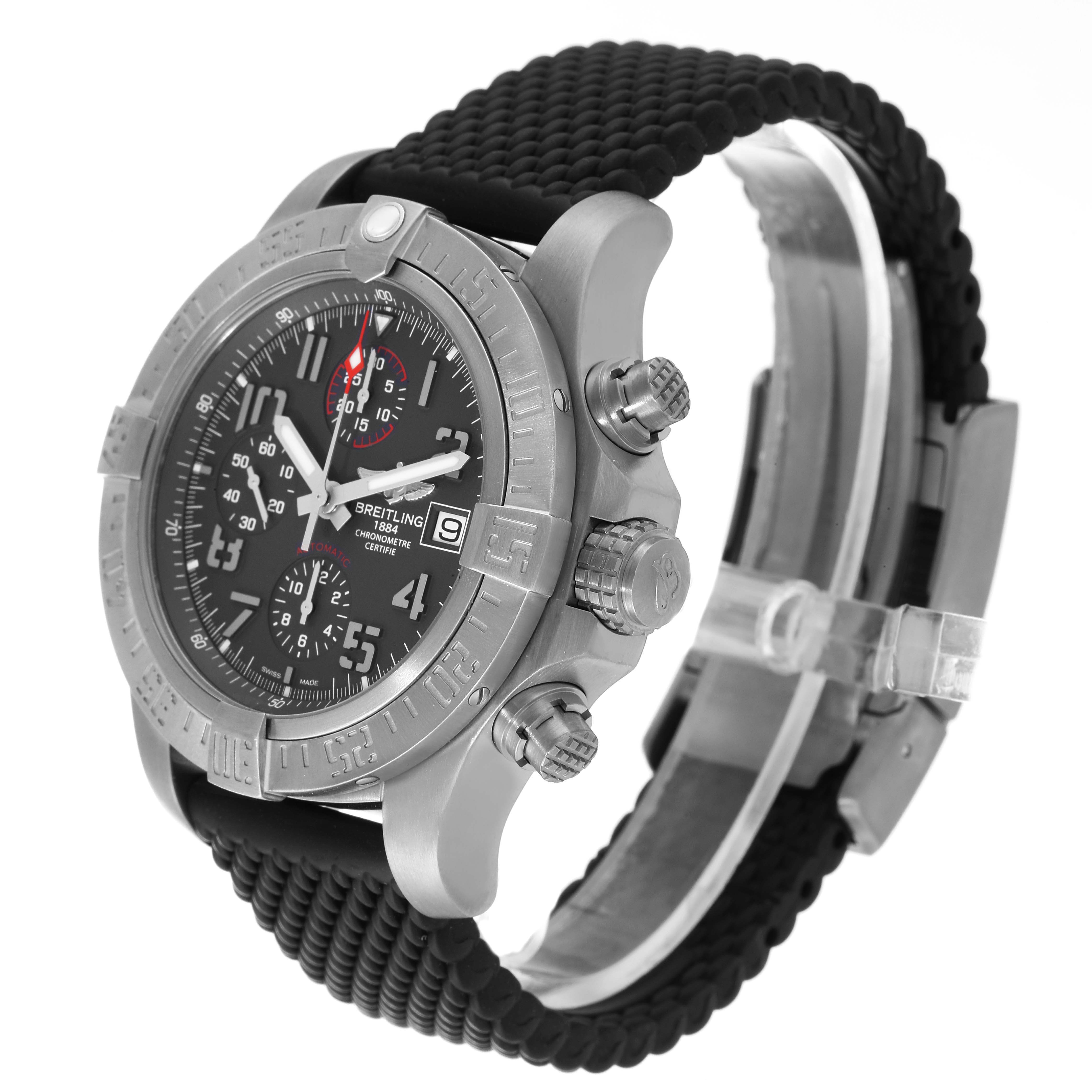 The image shows a Breitling Avenger E13383 Men's Titanium Grey Dial E13383 Men's Titanium Grey Dial watch at a slight angle, highlighting the face, bezel, pushers, and textured black strap.