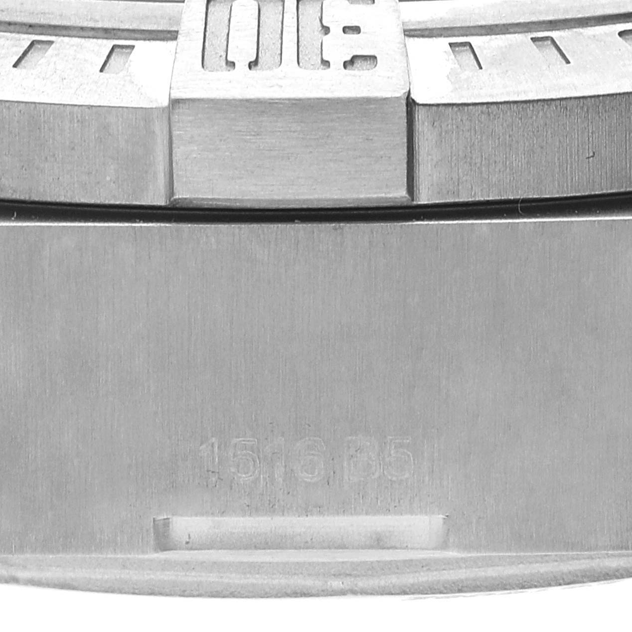 Close-up of the bezel and case of a Breitling Avenger E13383 Men's Titanium Grey Dial E13383 Men's Titanium Grey Dial watch, showing the 15-minute marker and part of the serial number.