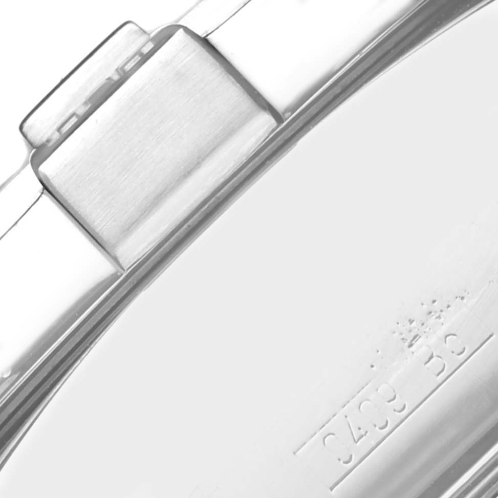 The image shows a close-up of the clasp on a Breitling Avenger A13380 / A338C94PRS Men's Stainless Steel Blue Dial A13380 / A338C94PRS Men's Stainless Steel Blue Dial watch band, focusing on its metal texture and engraved details.