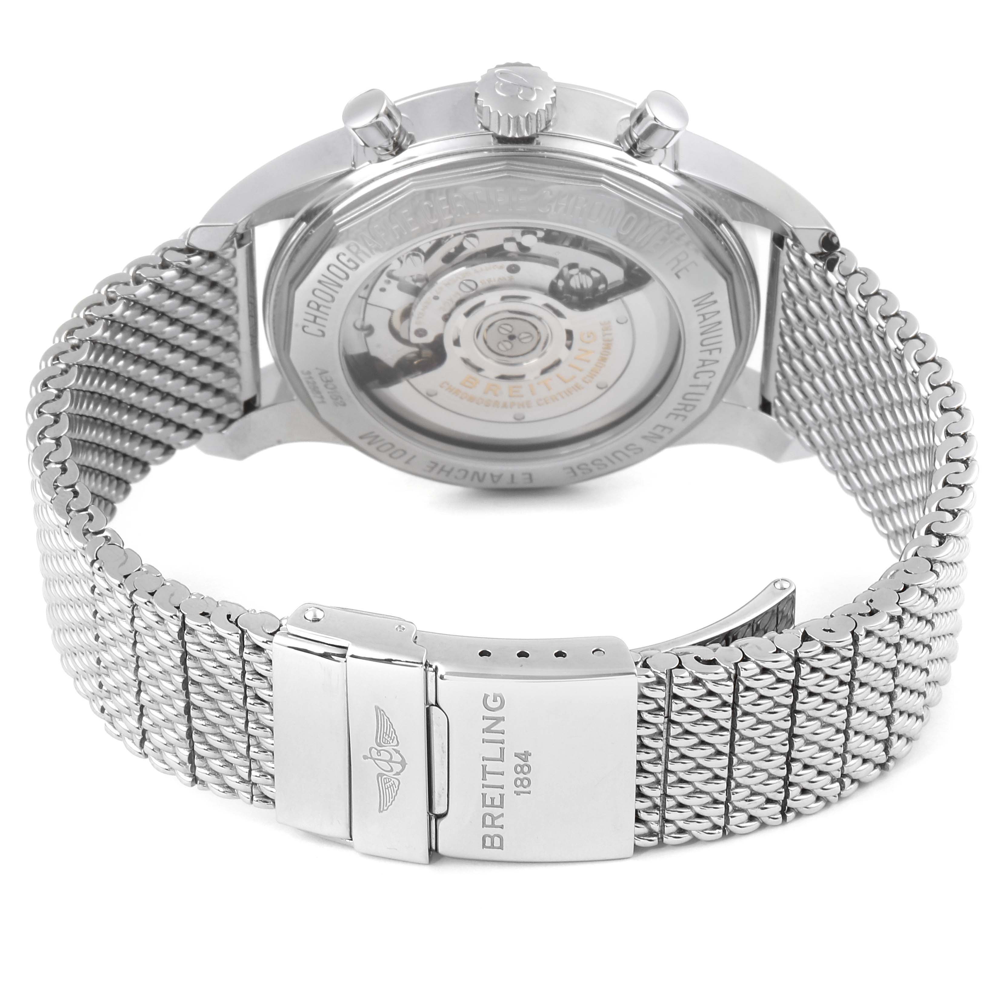 The image shows the back of a Breitling Transocean AB015212/BA99/154A Men's Stainless Steel Black Dial AB015212/BA99/154A Men's Stainless Steel Black Dial watch, highlighting its stainless steel mesh band and the transparent case back.