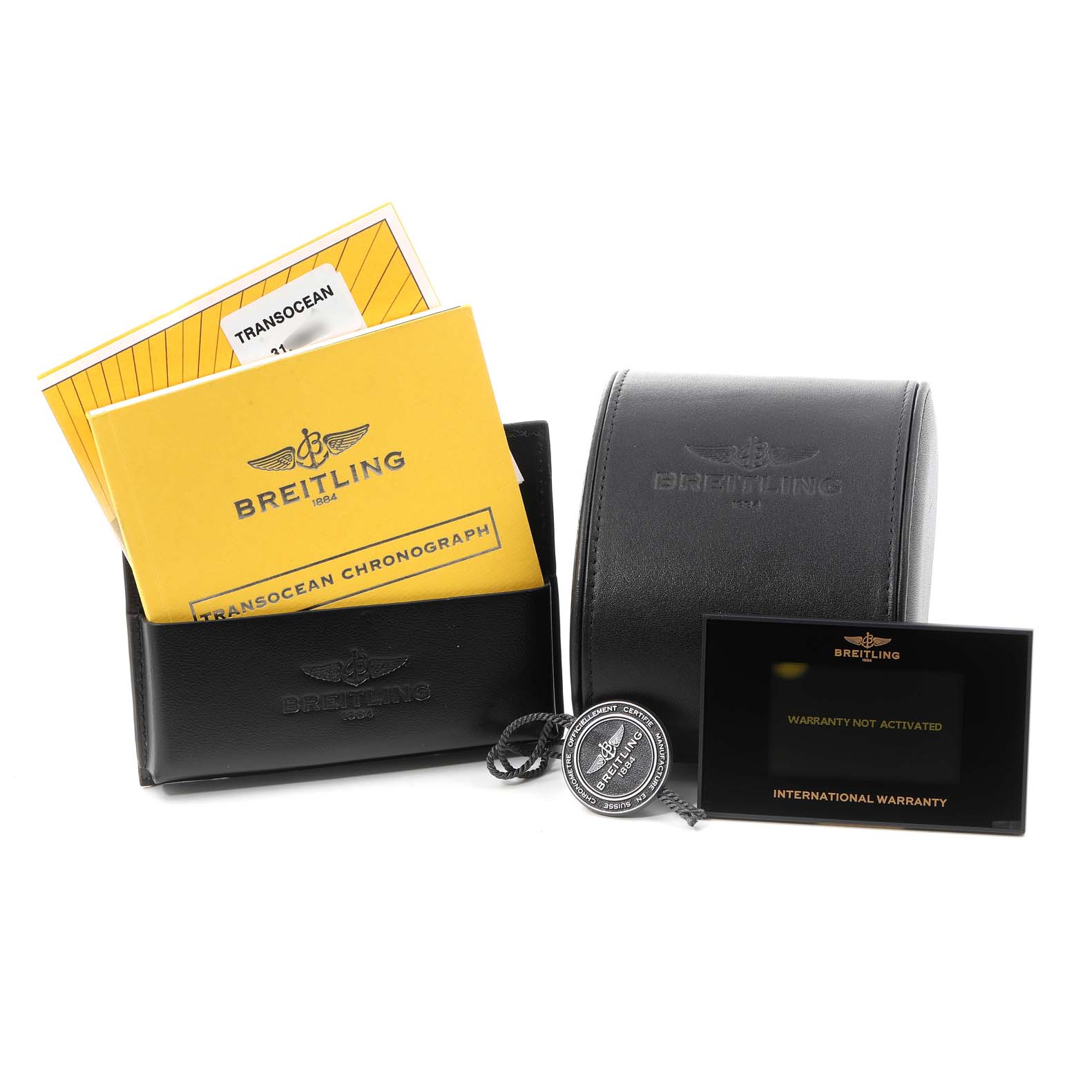 The image displays the packaging, warranty card, instruction booklets, and a tag for the Breitling Transocean AB015212/BA99/154A Men's Stainless Steel Black Dial AB015212/BA99/154A Men's Stainless Steel Black Dial watch model.