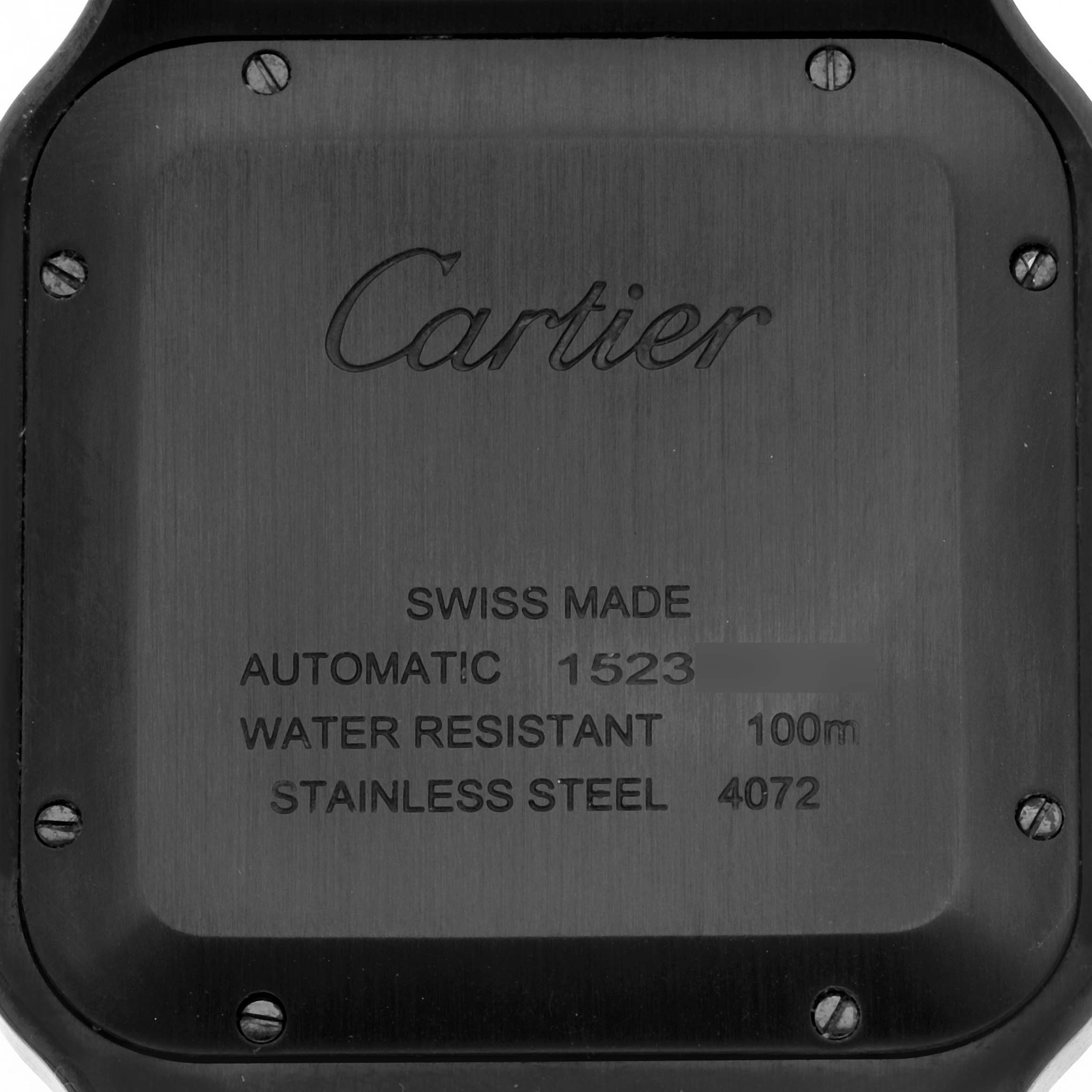 The image shows the back case of a Cartier Santos WSSA0039 Men's Stainless Steel Black Dial WSSA0039 Men's Stainless Steel Black Dial watch with engraved details like "Swiss Made" and "Automatic."