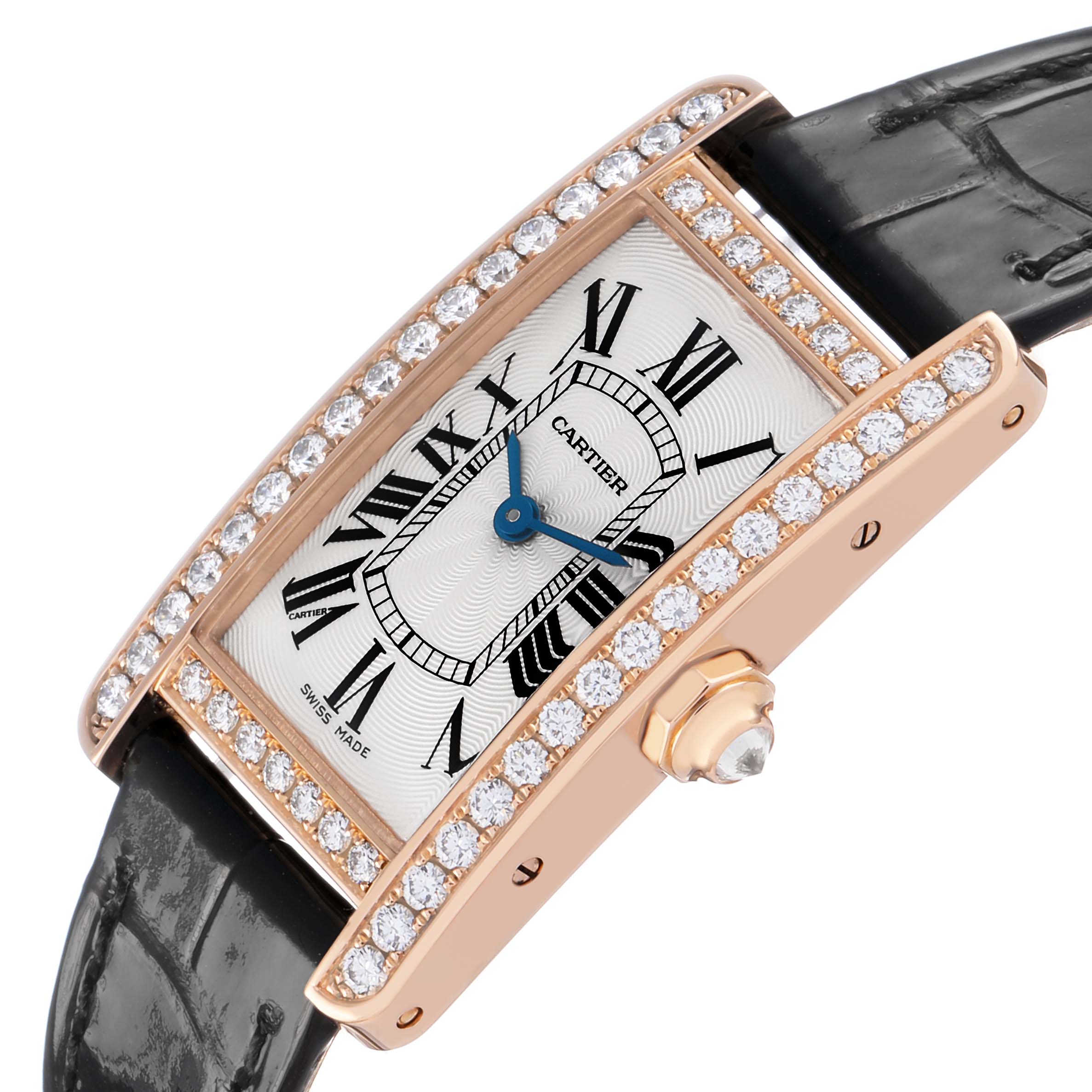 The Cartier Tank Americaine WJTA0002 Women's Rose Gold Silver Dial watch is shown at a slight side angle, highlighting its diamond-studded bezel and black strap.