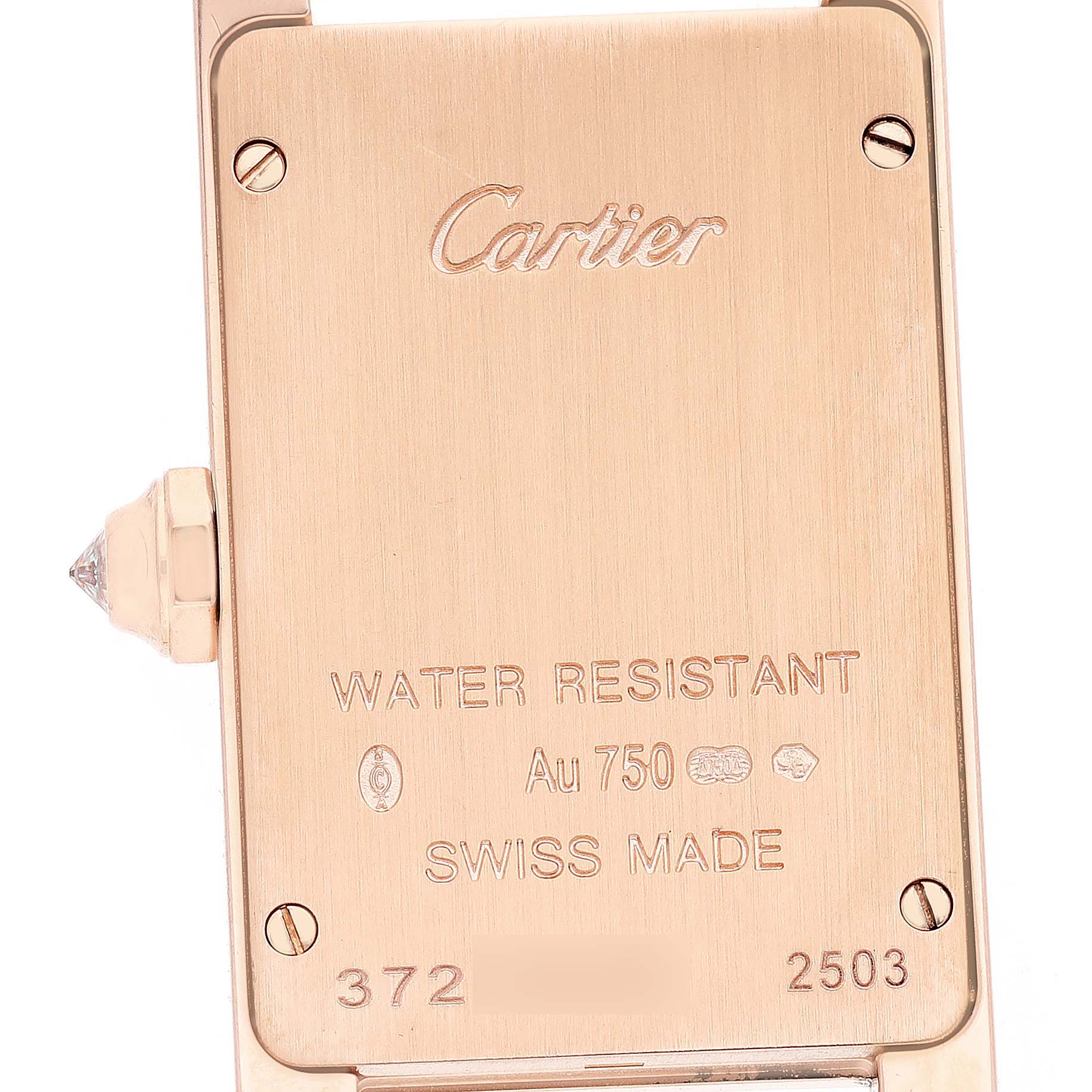 The image shows the back of a Cartier Tank Americaine WJTA0002 Women's Rose Gold Silver Dial watch, highlighting its engravings and gold crown.