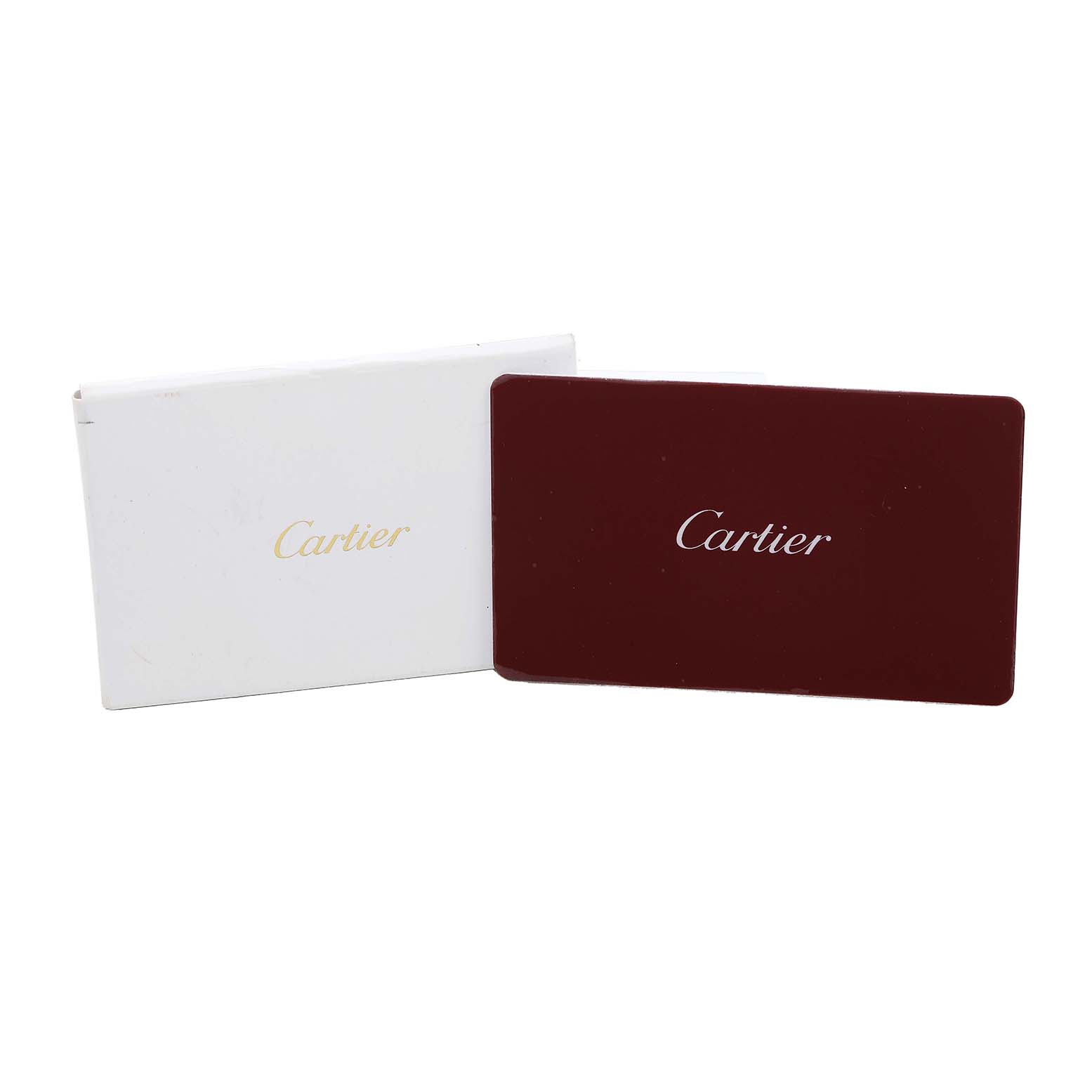 The image shows Cartier packaging and a card, likely for the Tank Louis model watch.