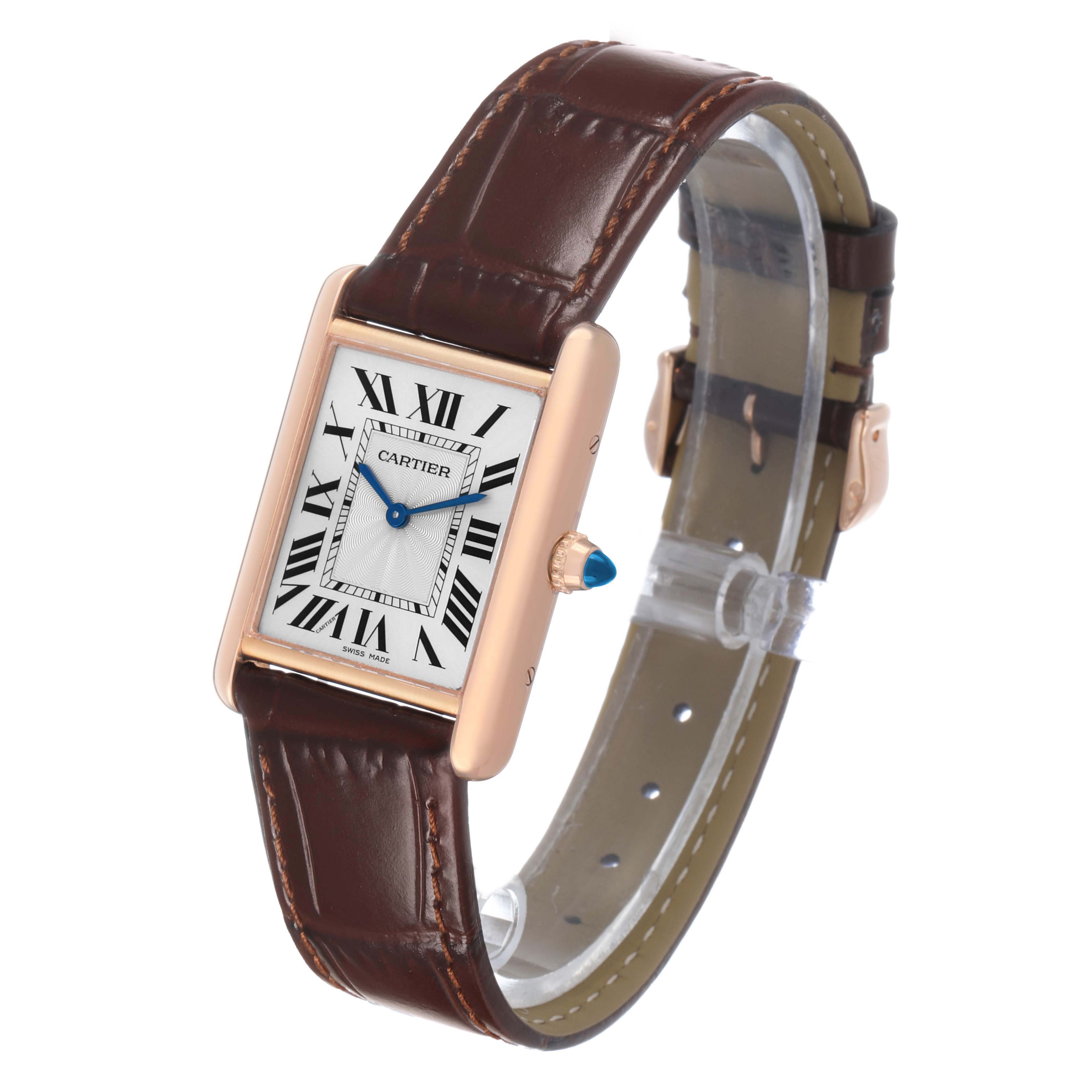 The Cartier Tank Louis WGTA0011 Men's Rose Gold Silver Dial watch is shown at an angled view, displaying the face, strap, and crown with a blue jewel.