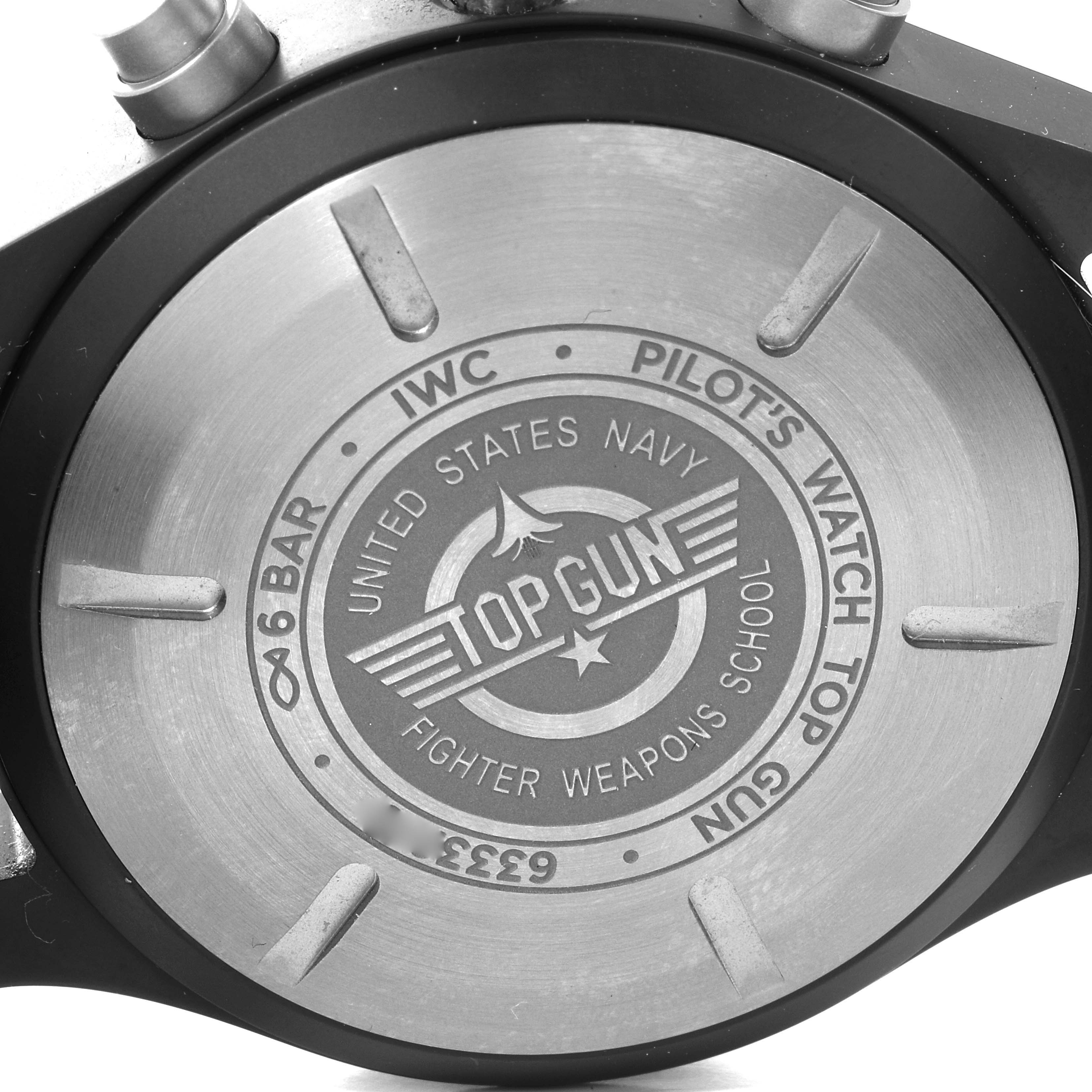 This image shows the back case of the IWC Pilot IW389101 Men's Ceramic Black Dial IW389101 Men's Ceramic Black Dial Top Gun watch, highlighting its engravings and markings.