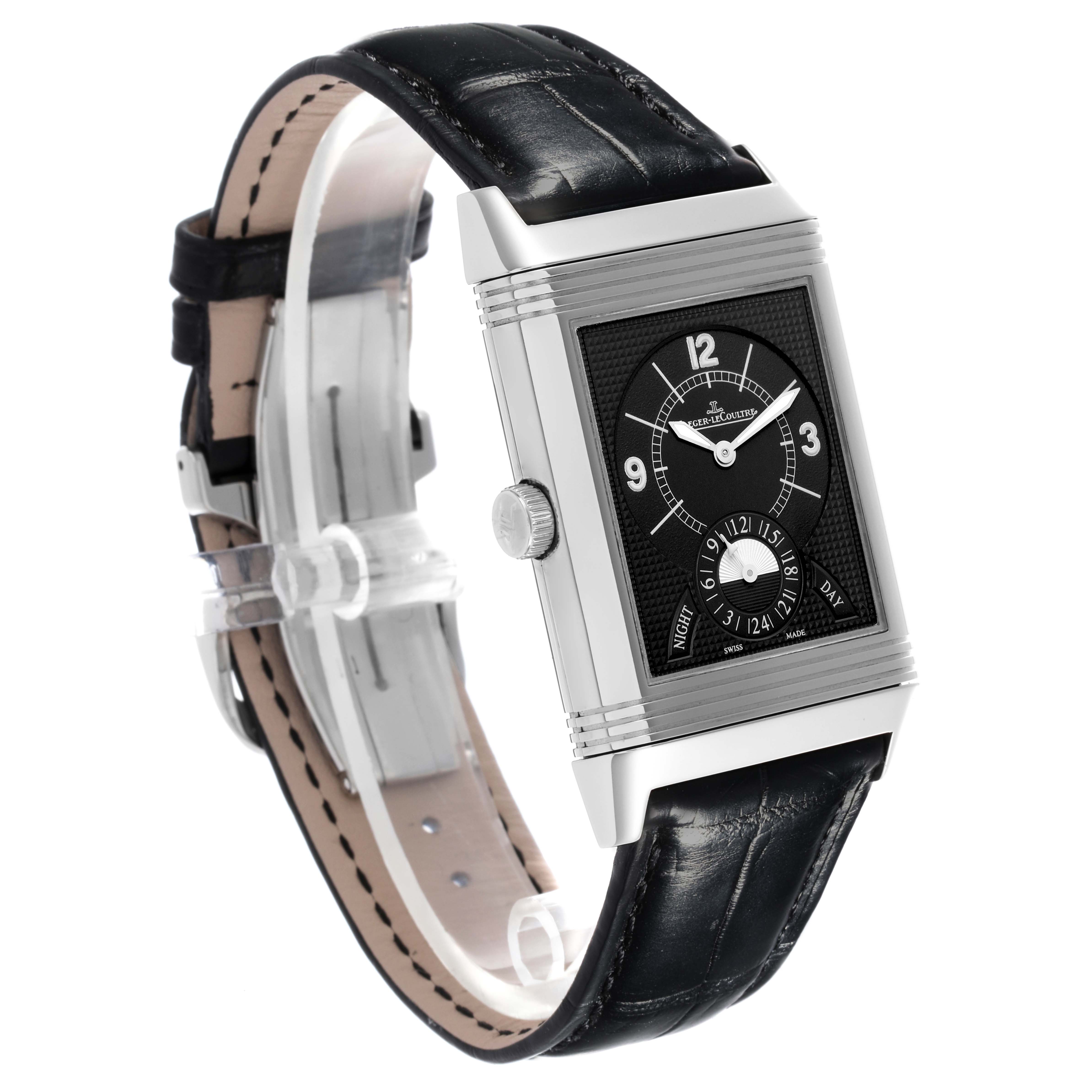 The Jaeger-LeCoultre Reverso watch is shown at a three-quarter angle, displaying its rectangular face, crown, and leather strap.
