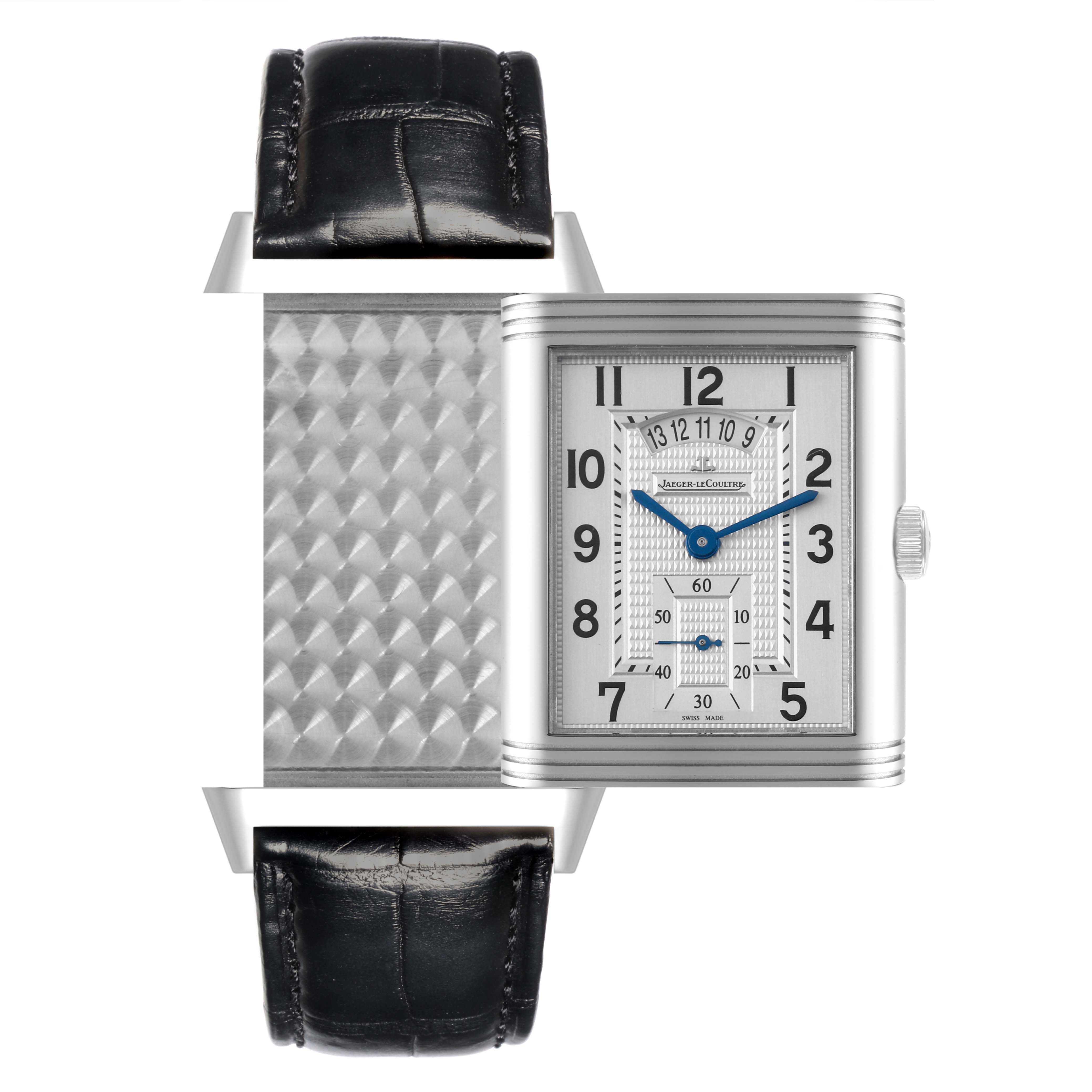 The Jaeger-LeCoultre Reverso watch is shown from the front with the reversible case extended, revealing the intricate pattern behind the dial.