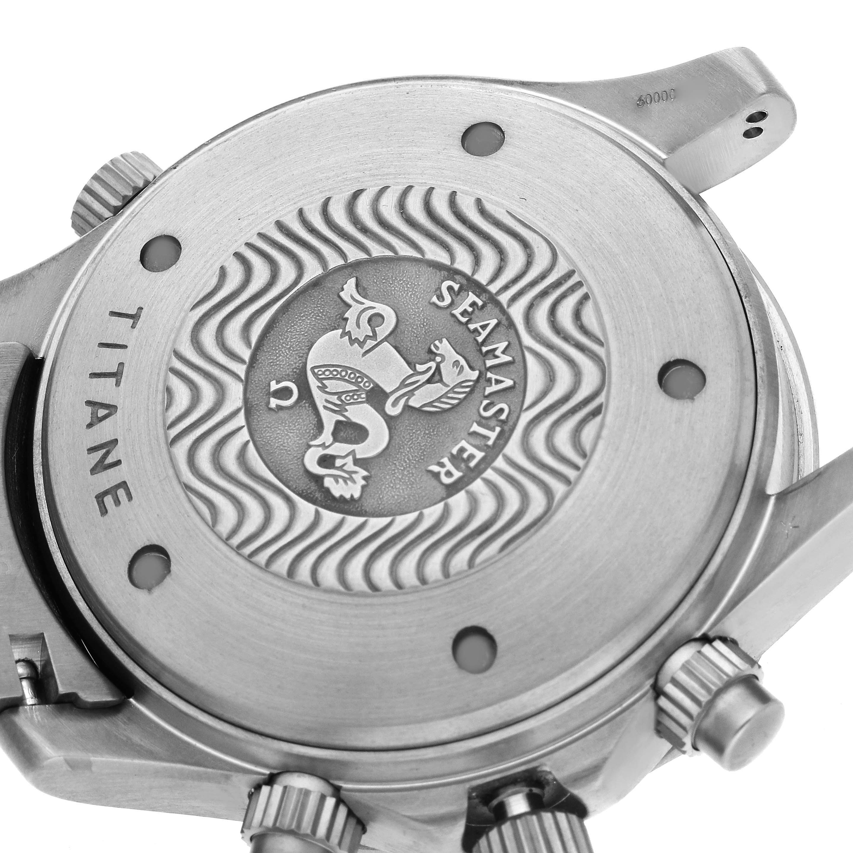 The image shows the case back of an Omega Seamaster 2298.80.00 Men's Titanium Blue Dial 2298.80.00 Men's Titanium Blue Dial, highlighting the engravings and crown from a close-up angle.