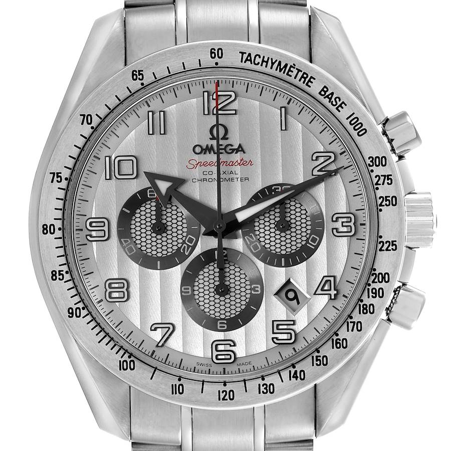 The Omega Speedmaster watch is shown from a front angle, displaying its face, chronograph dials, and tachymeter bezel.