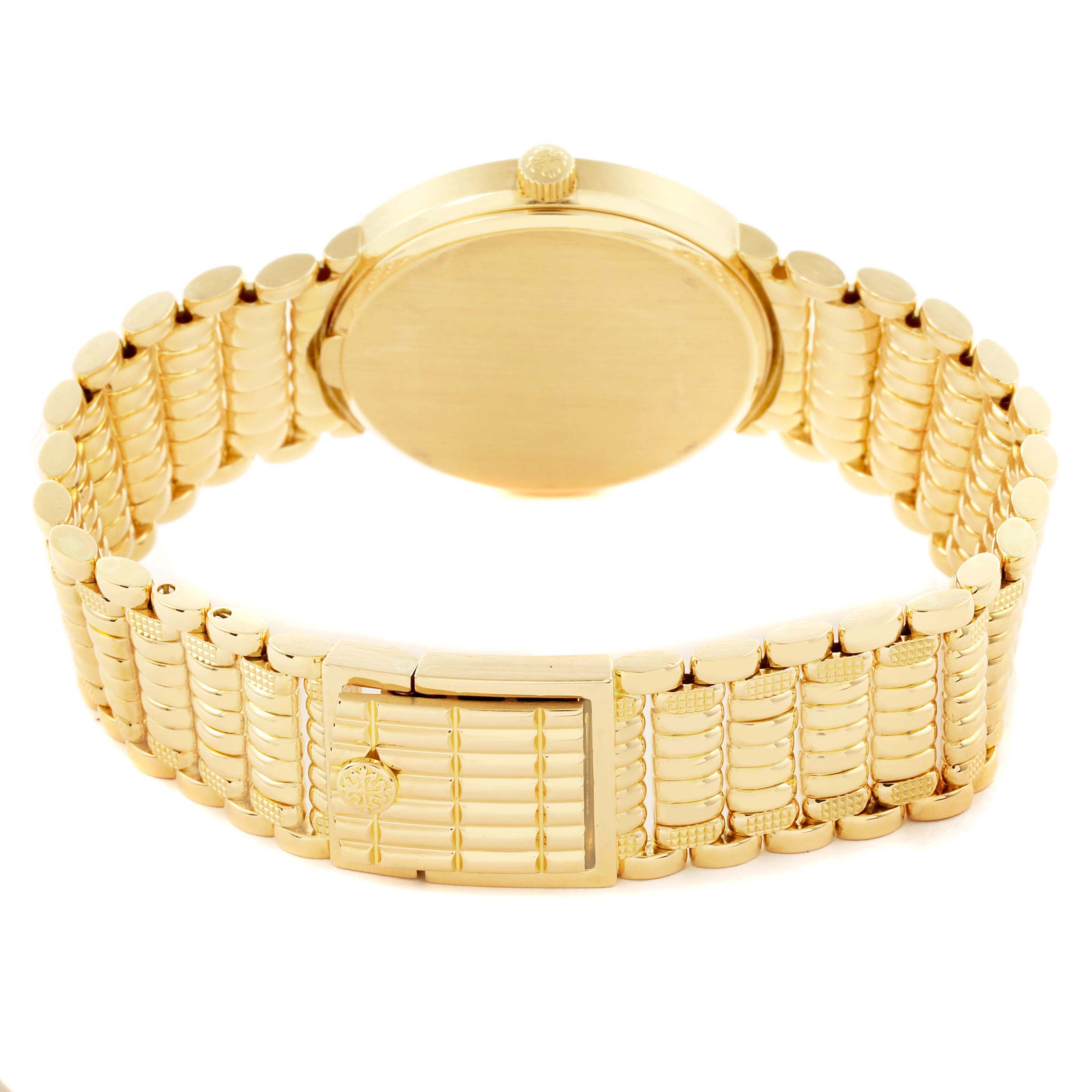 The image shows the back of a Patek Philippe Calatrava 3802/200 Men's Yellow Gold White Dial 3802/200 Men's Yellow Gold White Dial watch, highlighting the gold case, bracelet, and clasp.