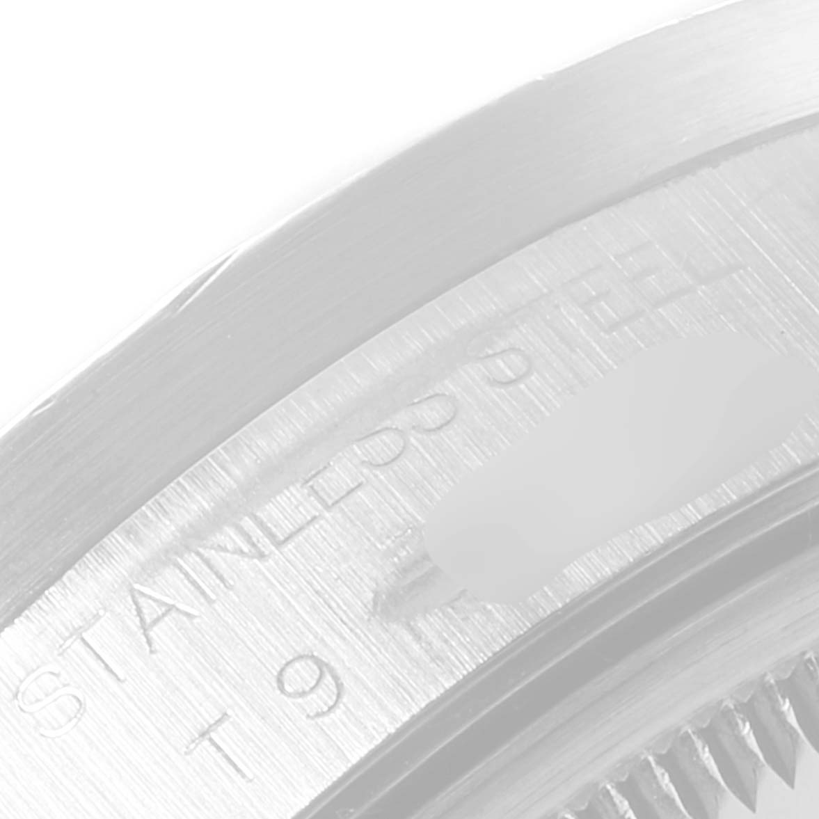 This image shows a close-up of the bezel and part of the casing of the Rolex Air-King 14010 Men's Stainless Steel Black Dial 14010 Men's Stainless Steel Black Dial watch, focusing on the text "STAINLESS STEEL."
