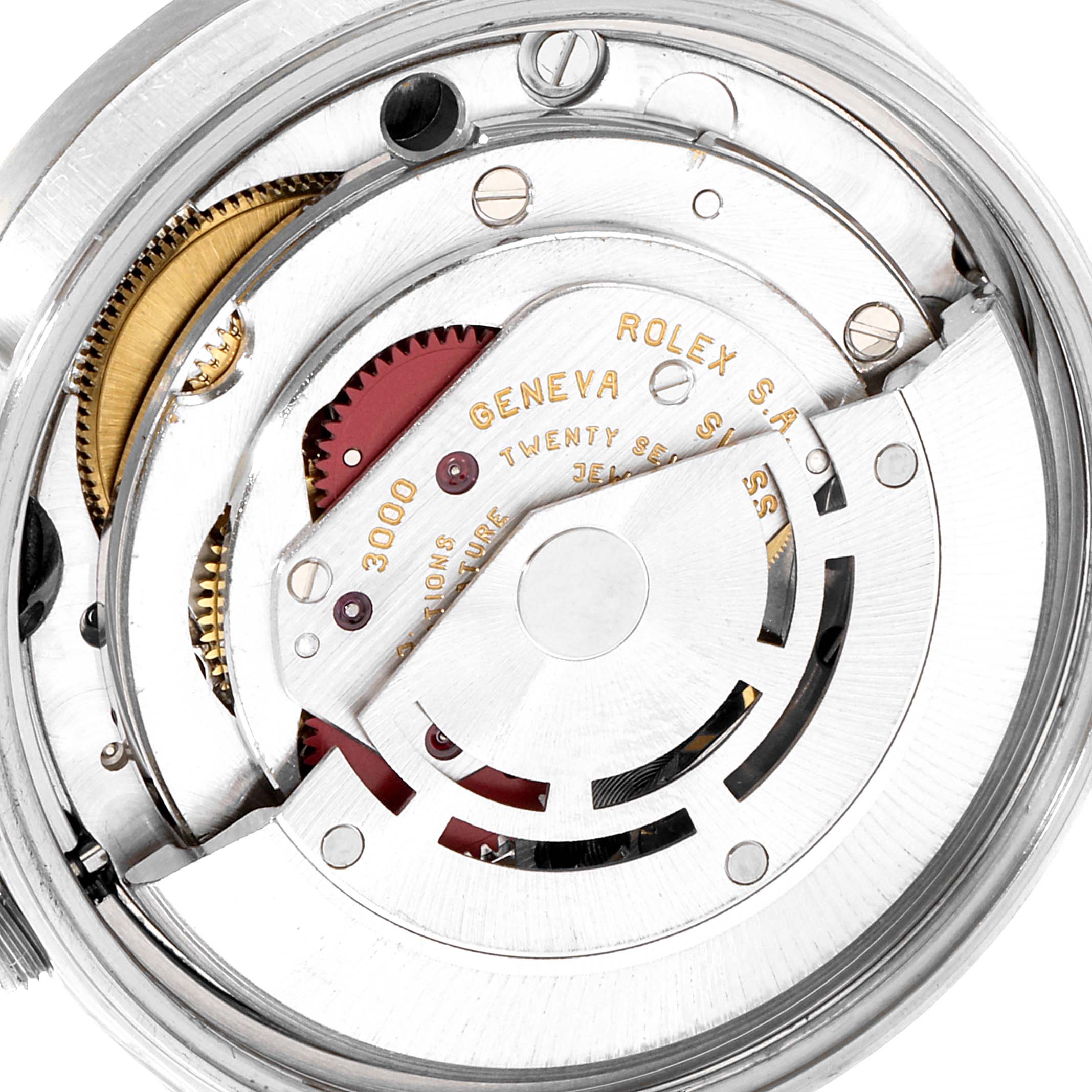 This image shows a close-up view of the internal mechanism of a Rolex Air-King 14010 Men's Stainless Steel Black Dial 14010 Men's Stainless Steel Black Dial watch, focusing on its gears and rotor.