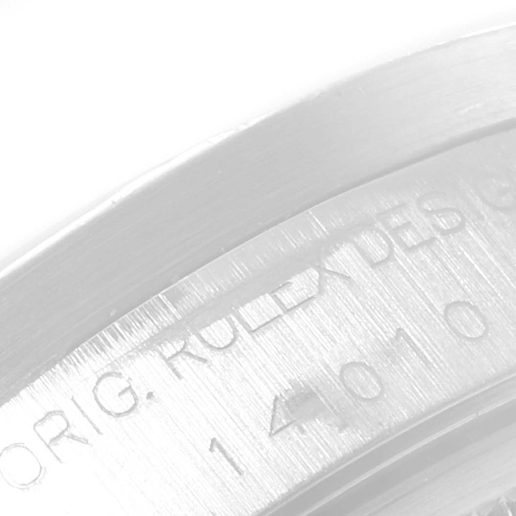 This close-up image of the Rolex Air-King 14010 Men's Stainless Steel Black Dial 14010 Men's Stainless Steel Black Dial watch focuses on the side engraving of the casing.