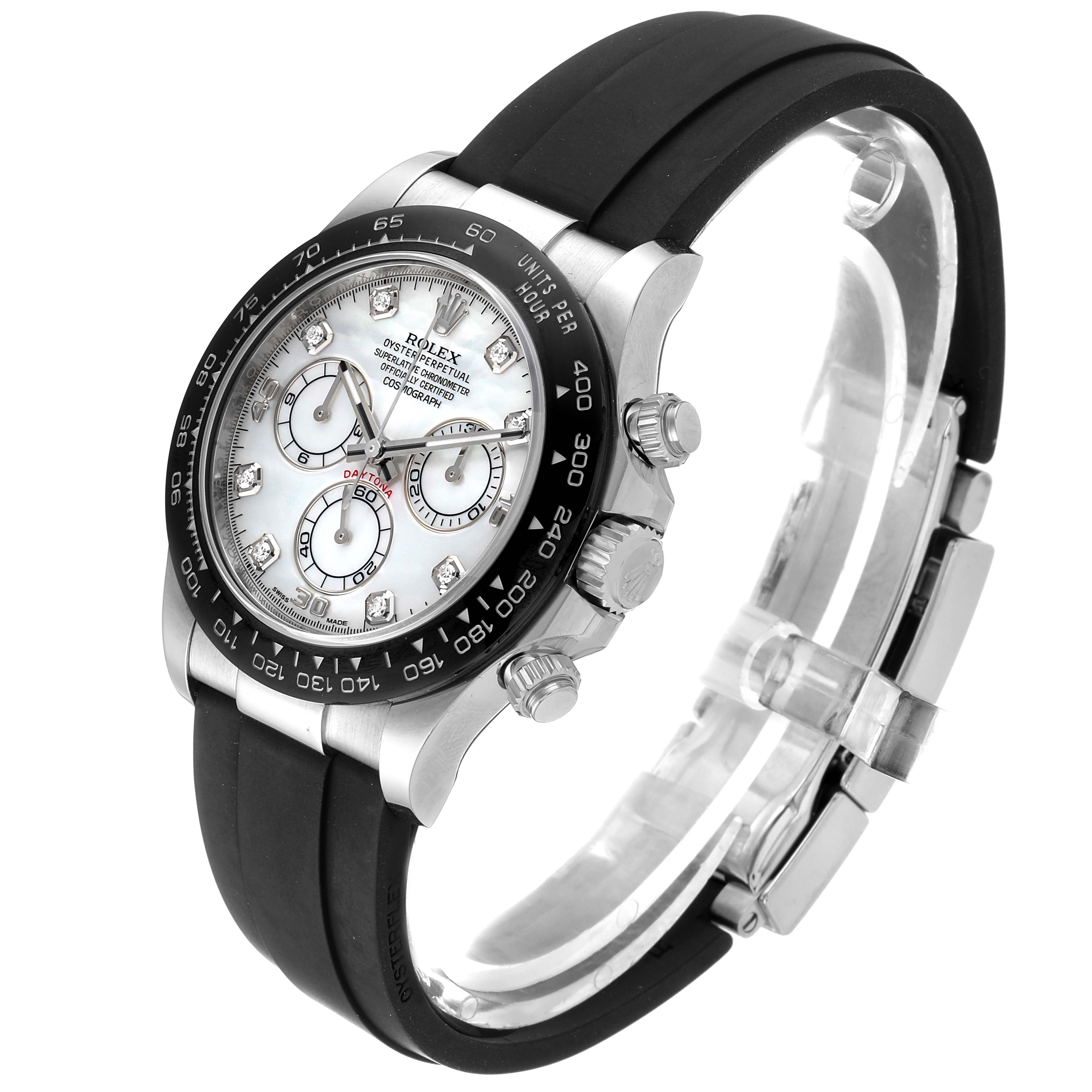 The image shows a Rolex Daytona 116519 Men's White Gold Mother of Pearl Dial 116519 Men's White Gold Mother of Pearl Dial watch at an angled view, highlighting the dial, bezel, crown, and black rubber strap.