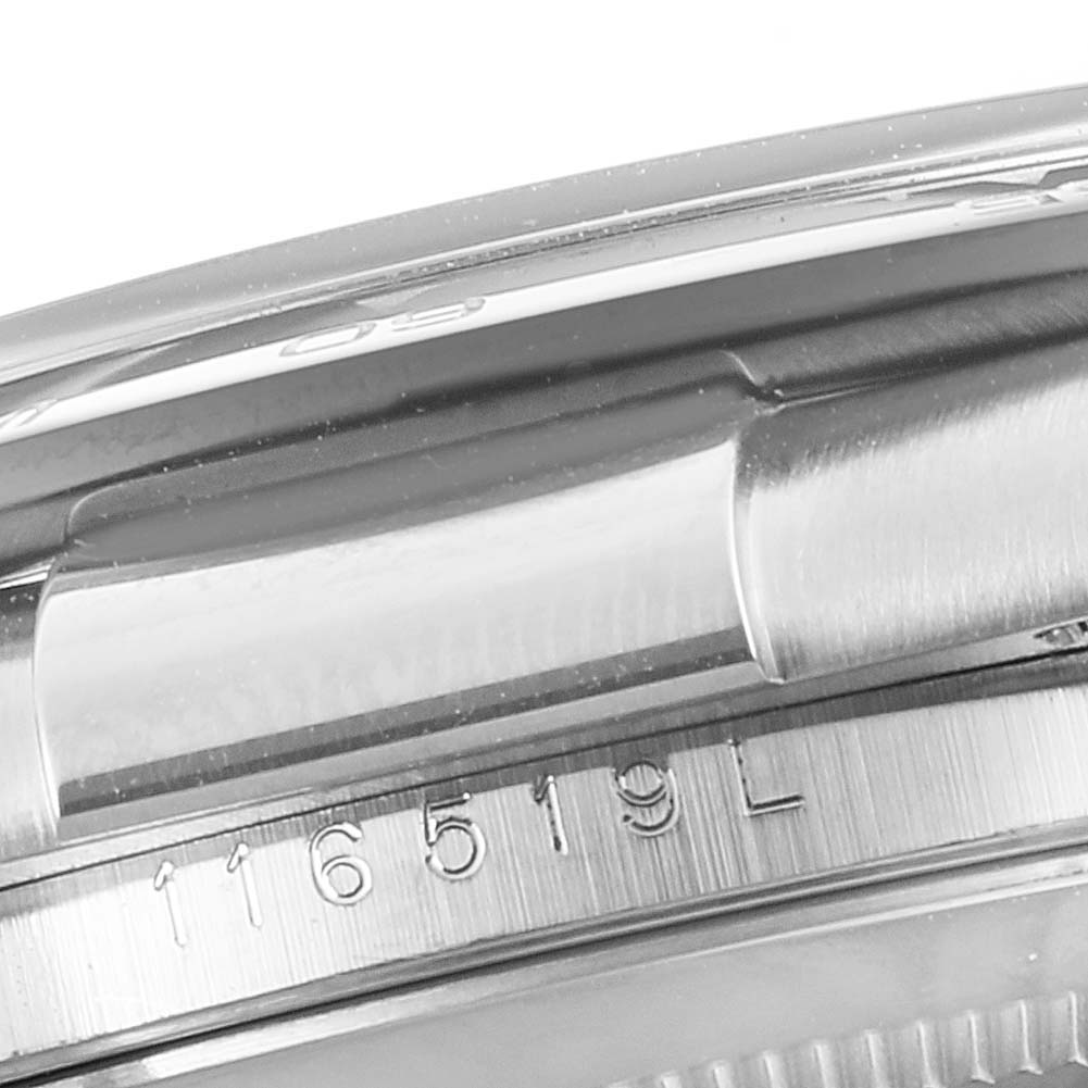 This image shows a close-up of the Daytona model by Rolex, highlighting the edge of the case and part of the serial number.