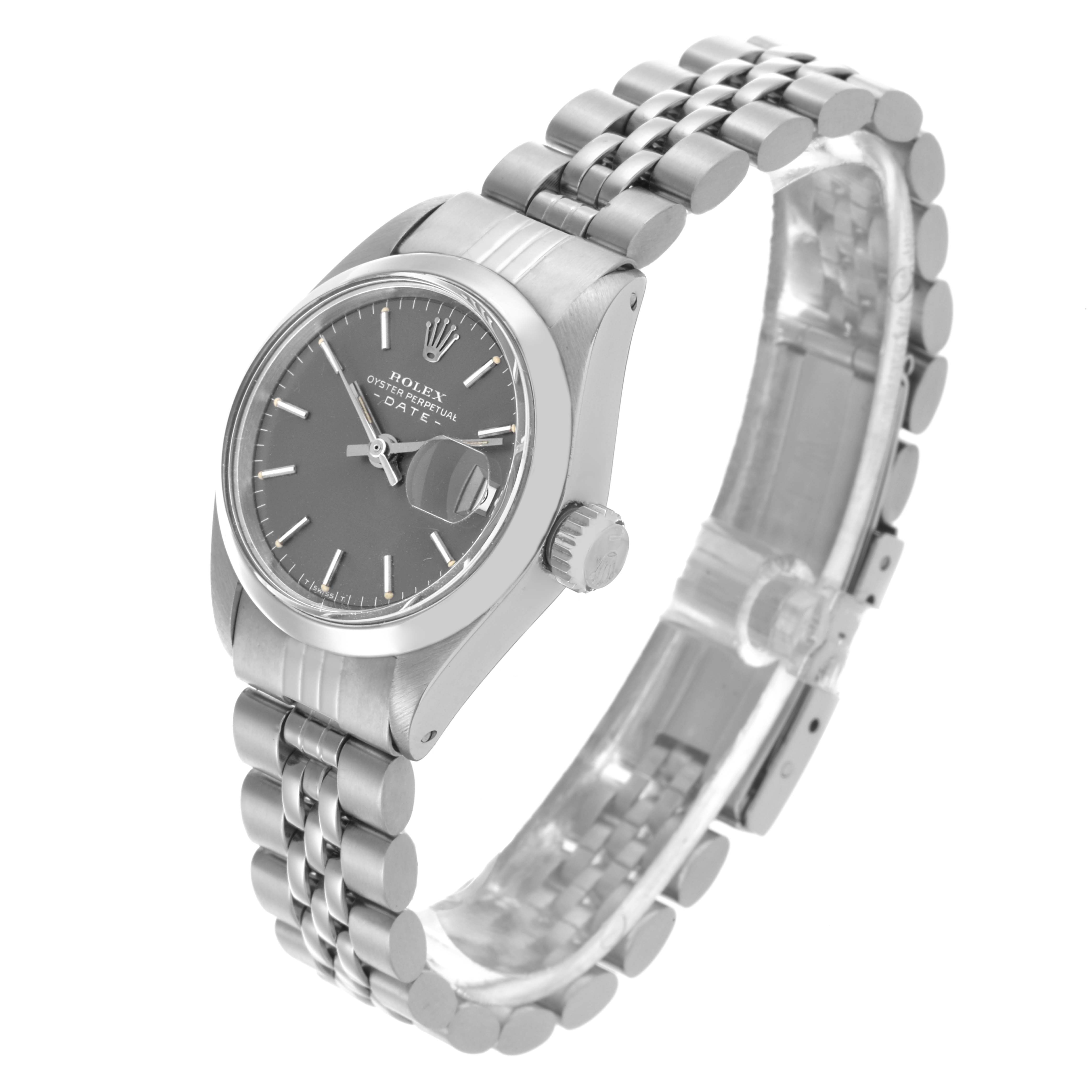 The Rolex Date 6916 Women's Stainless Steel Grey Dial 6916 Women's Stainless Steel Grey Dial watch is shown at an angled side view, highlighting the watch face, bezel, and Jubilee bracelet.