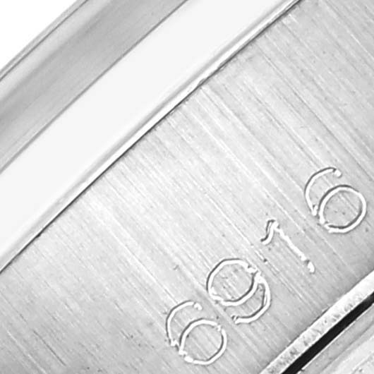 The image shows a close-up of the metal bracelet links with engraved markings of a Rolex Date 6916 Women's Stainless Steel Grey Dial 6916 Women's Stainless Steel Grey Dial model.