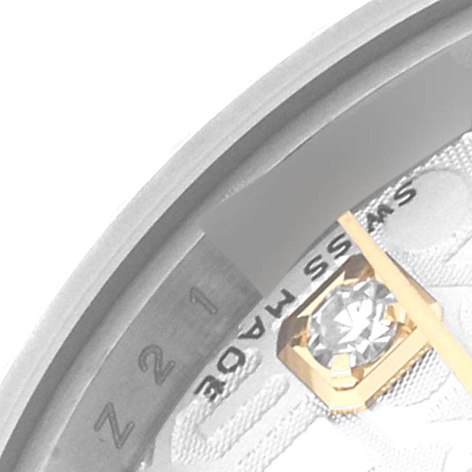 Close-up of the dial edge of a Rolex Datejust 179173 Women's Steel and Gold (two tone) Silver Dial 179173 Women's Steel and Gold (two tone) Silver Dial, showing part of the diamond-studded hour marker and "SWISS MADE" text.