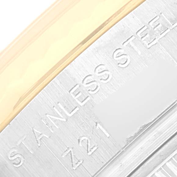 The image shows a close-up of the side of the stainless steel case of a Rolex Datejust 179173 Women's Steel and Gold (two tone) Silver Dial 179173 Women's Steel and Gold (two tone) Silver Dial watch.