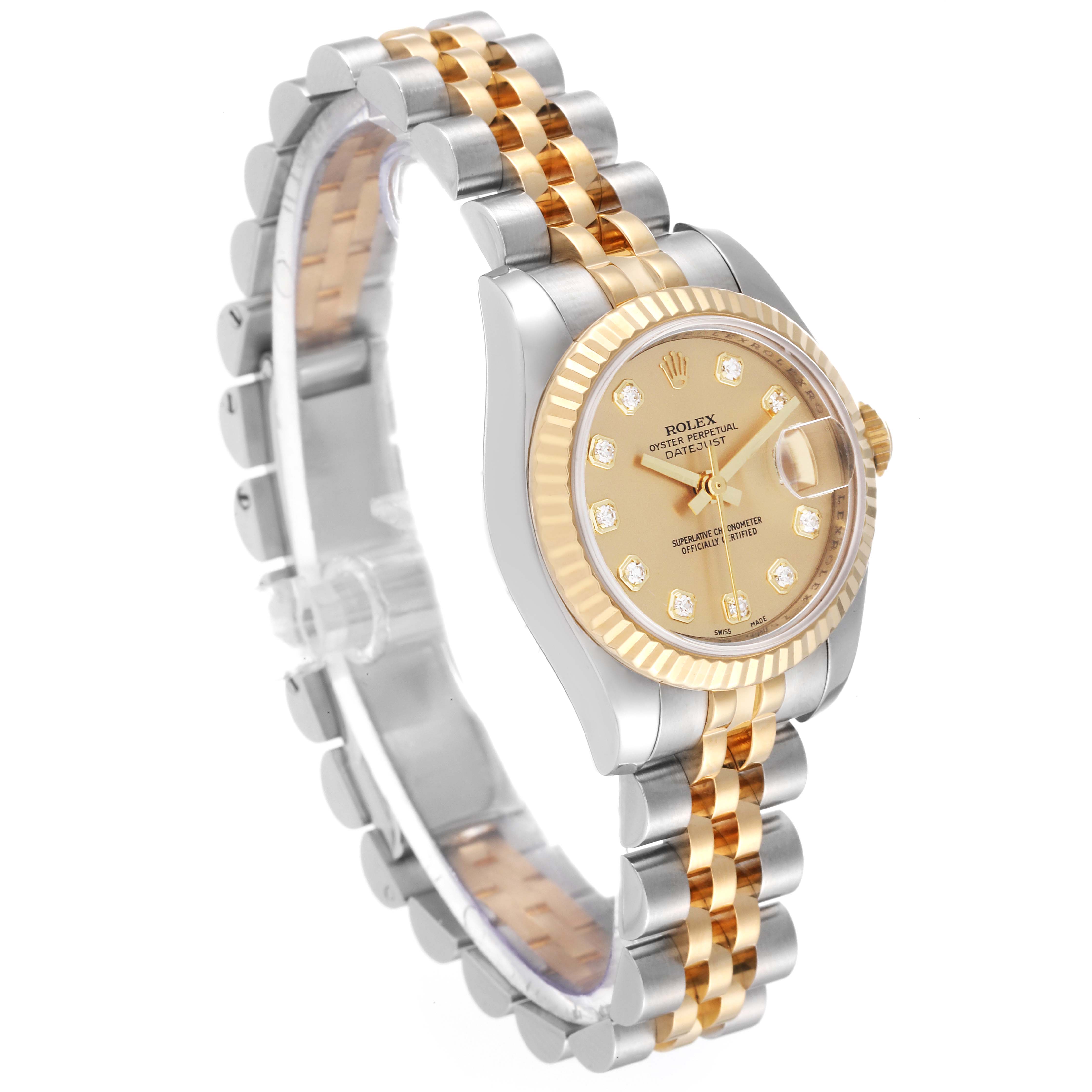 The Rolex Datejust 179173 Women's Steel and Gold (two tone) Champagne Dial 179173 Women's Steel and Gold (two tone) Champagne Dial watch is shown at a three-quarter angle, highlighting its gold diamond-set dial, fluted bezel, and two-tone bracelet.