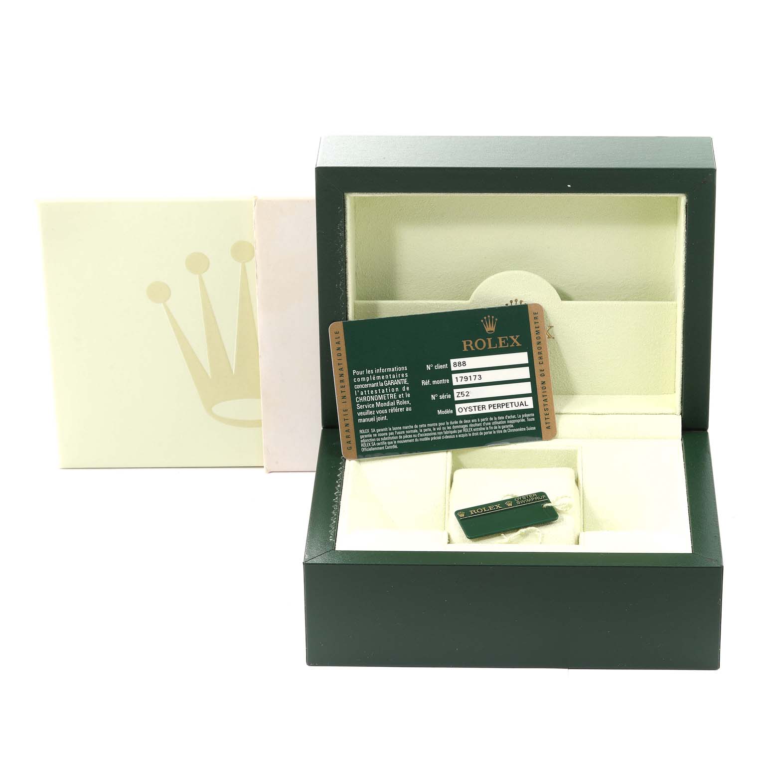 The image shows the packaging and accessories, including a card and tag, for a Rolex Datejust 179173 Women's Steel and Gold (two tone) Champagne Dial 179173 Women's Steel and Gold (two tone) Champagne Dial watch, without the watch visible.