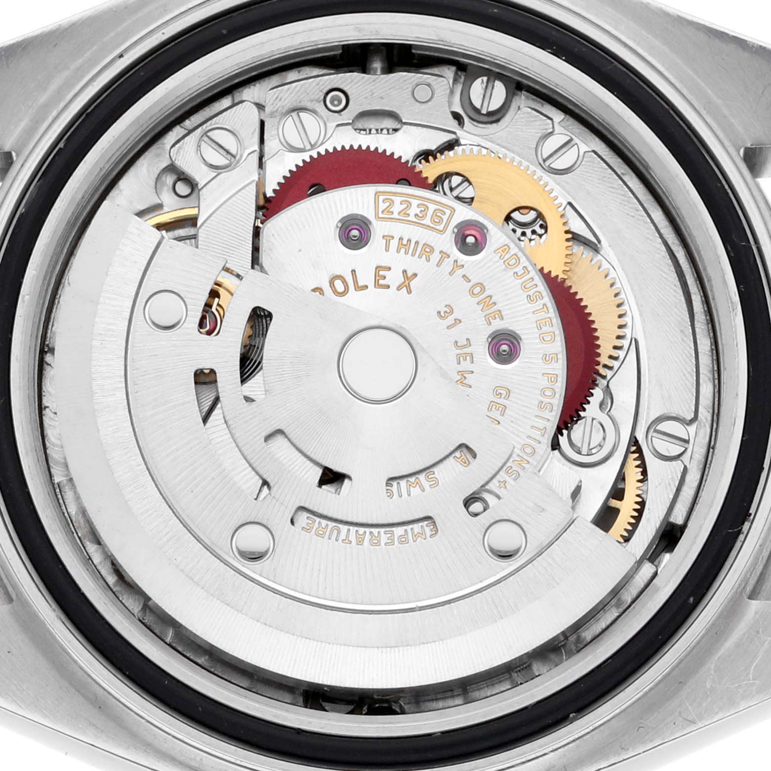 This image shows the movement of a Rolex Datejust 279160 Women's Stainless Steel Silver Dial 279160 Women's Stainless Steel Silver Dial watch viewed from the back, highlighting gears and the rotor.