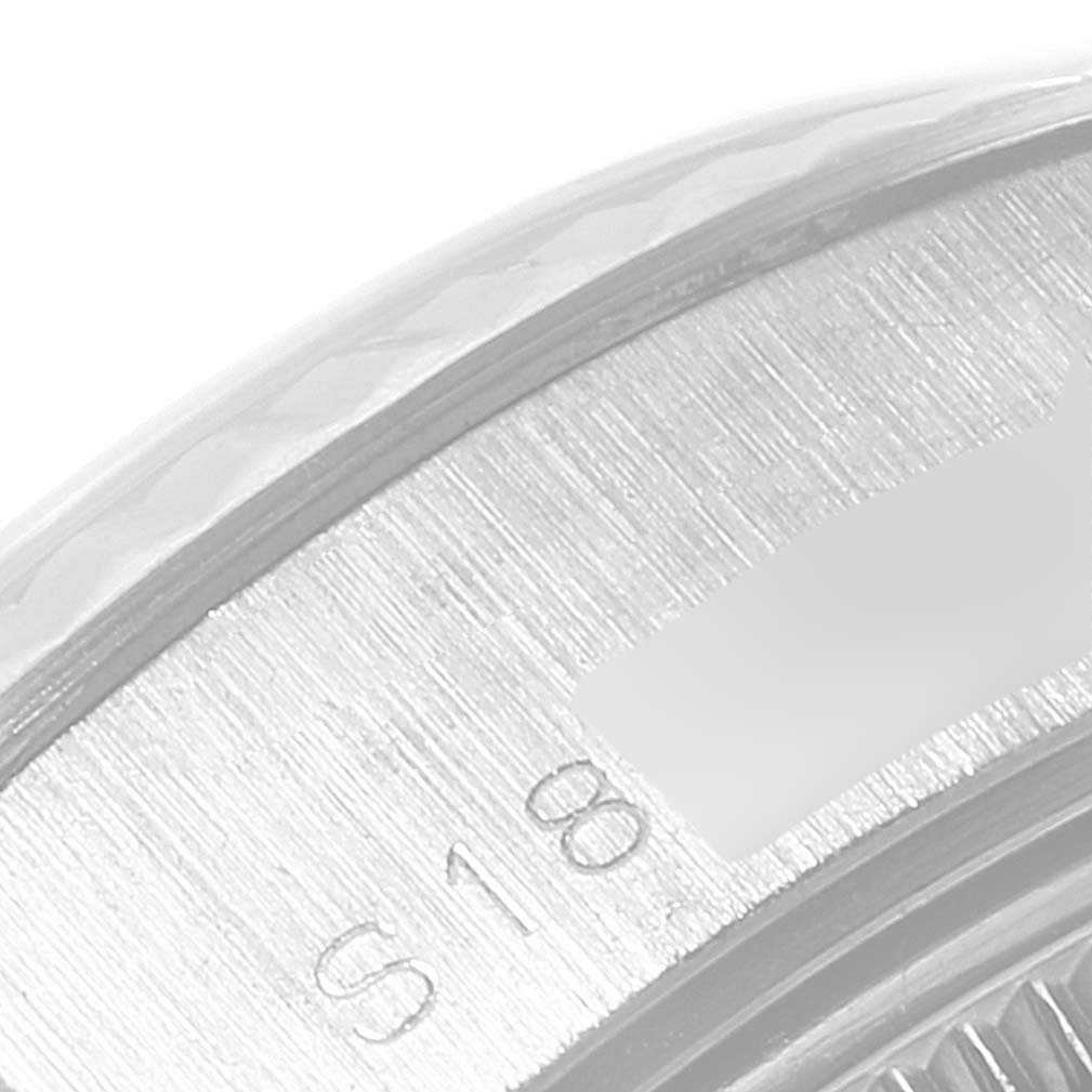 The image shows a close-up of the engraved bezel and part of the dial from the Rolex Datejust 69174 Women
s Stainless Steel Blue Dial 69174 Women
s Stainless Steel Blue Dial model watch.