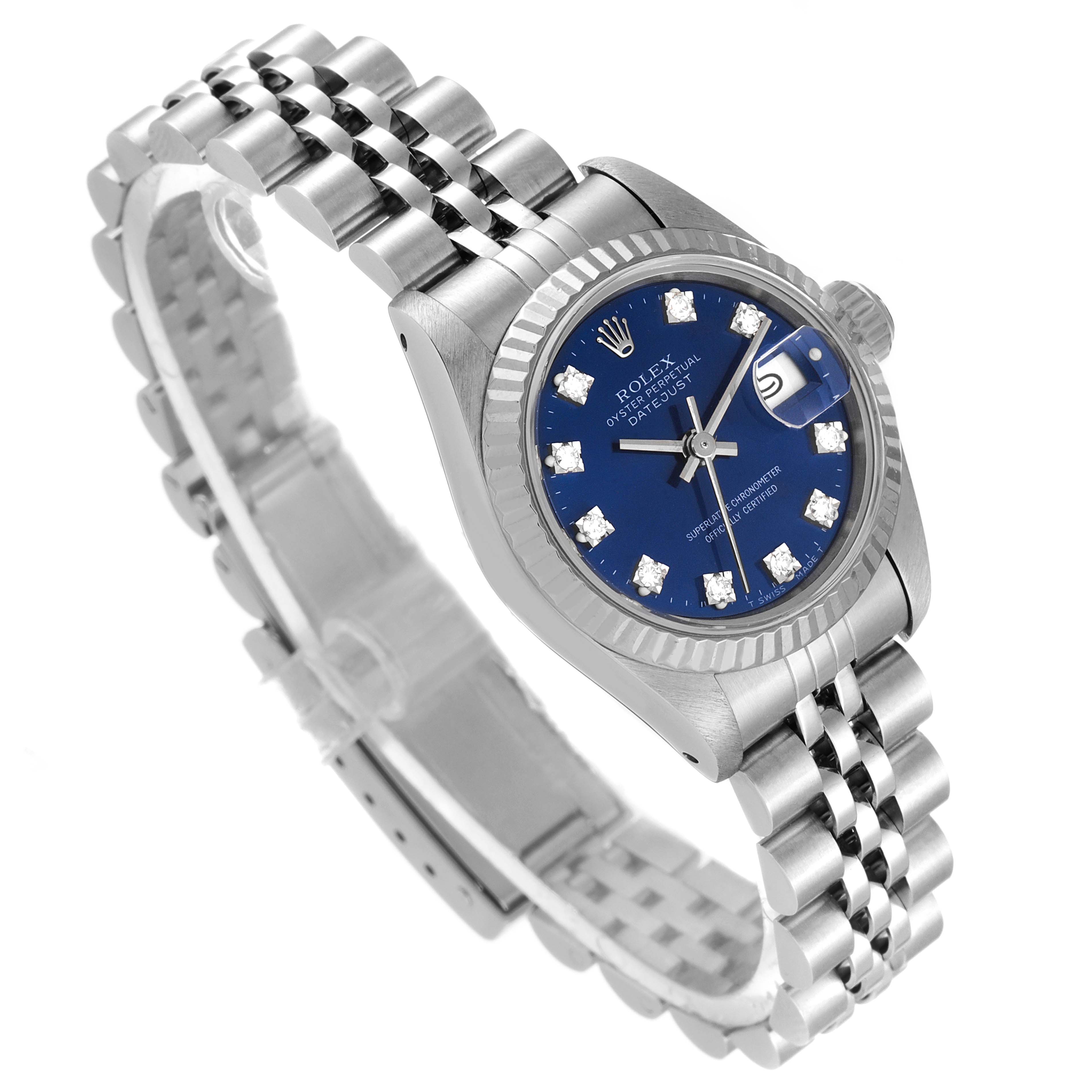 The Rolex Datejust 69174 Women
s Stainless Steel Blue Dial 69174 Women
s Stainless Steel Blue Dial watch is shown at a slight angle, highlighting its blue dial, fluted bezel, diamond hour markers, and Jubilee bracelet.