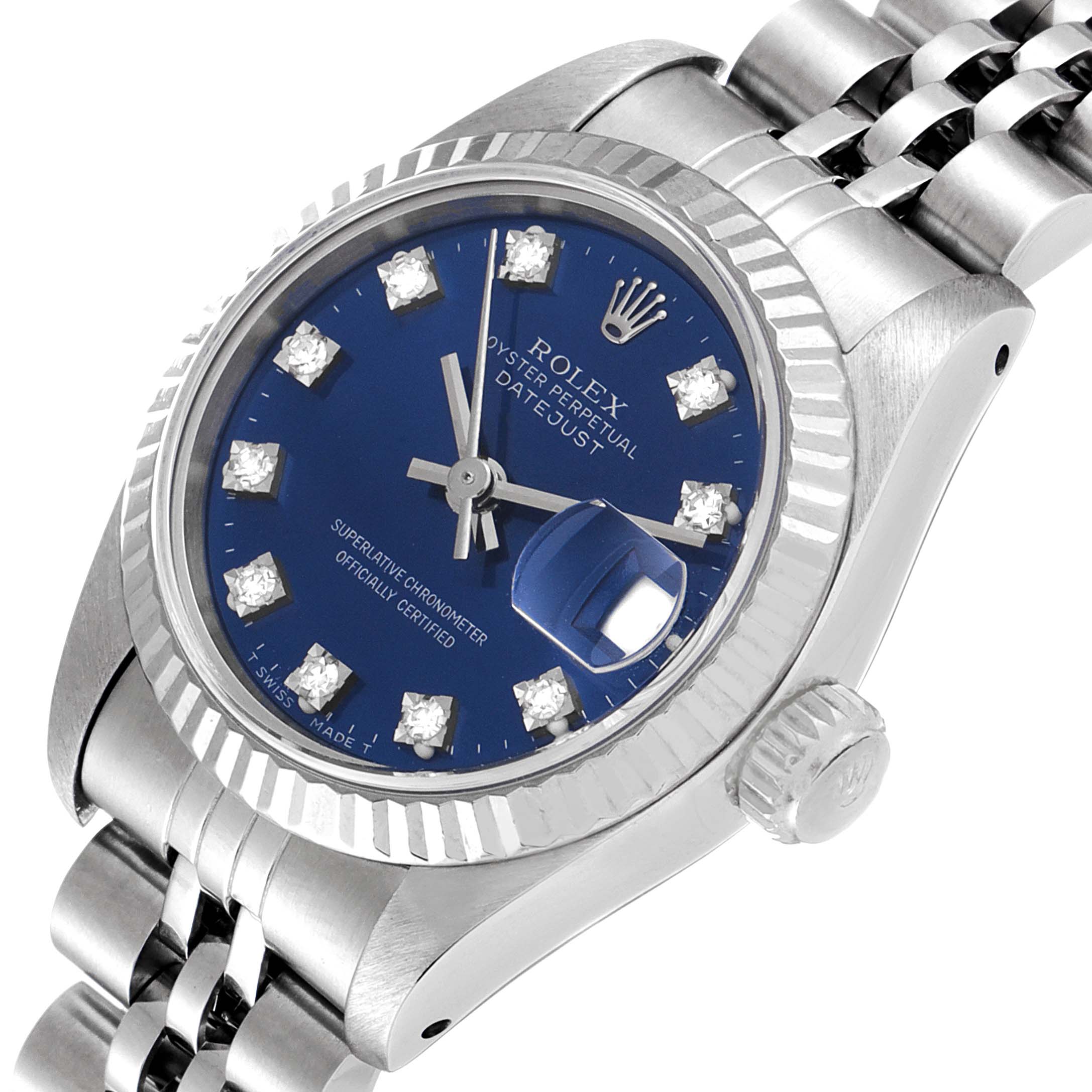 The Rolex Datejust 69174 Women
s Stainless Steel Blue Dial 69174 Women
s Stainless Steel Blue Dial watch in this image is shown at an angle, highlighting the dial, bezel, and part of the bracelet.