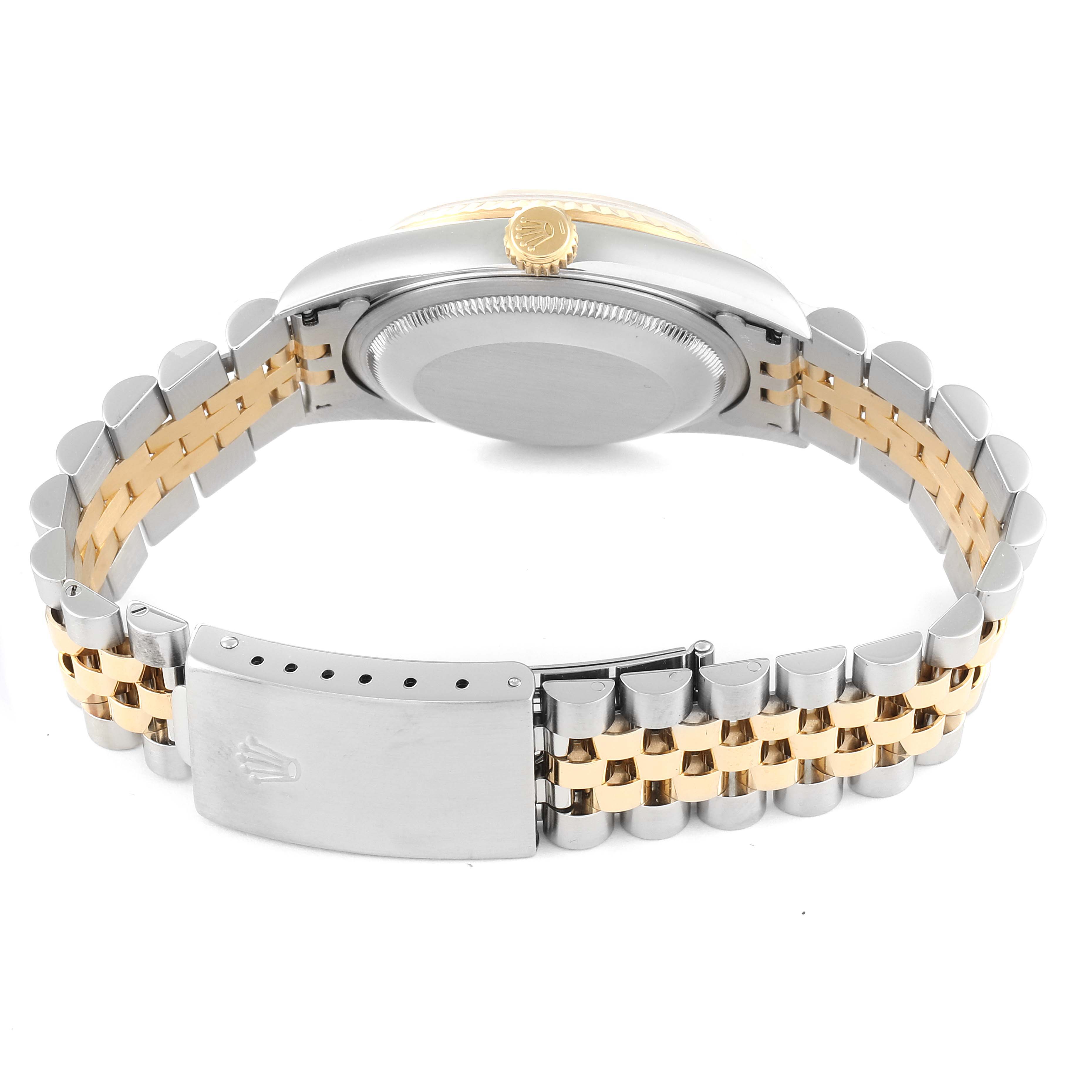 The image shows the back view of a Rolex Datejust 16233 Men's Steel and Gold (two tone) White Dial 16233 Men's Steel and Gold (two tone) White Dial watch, highlighting its two-tone bracelet, clasp, case back, and crown.