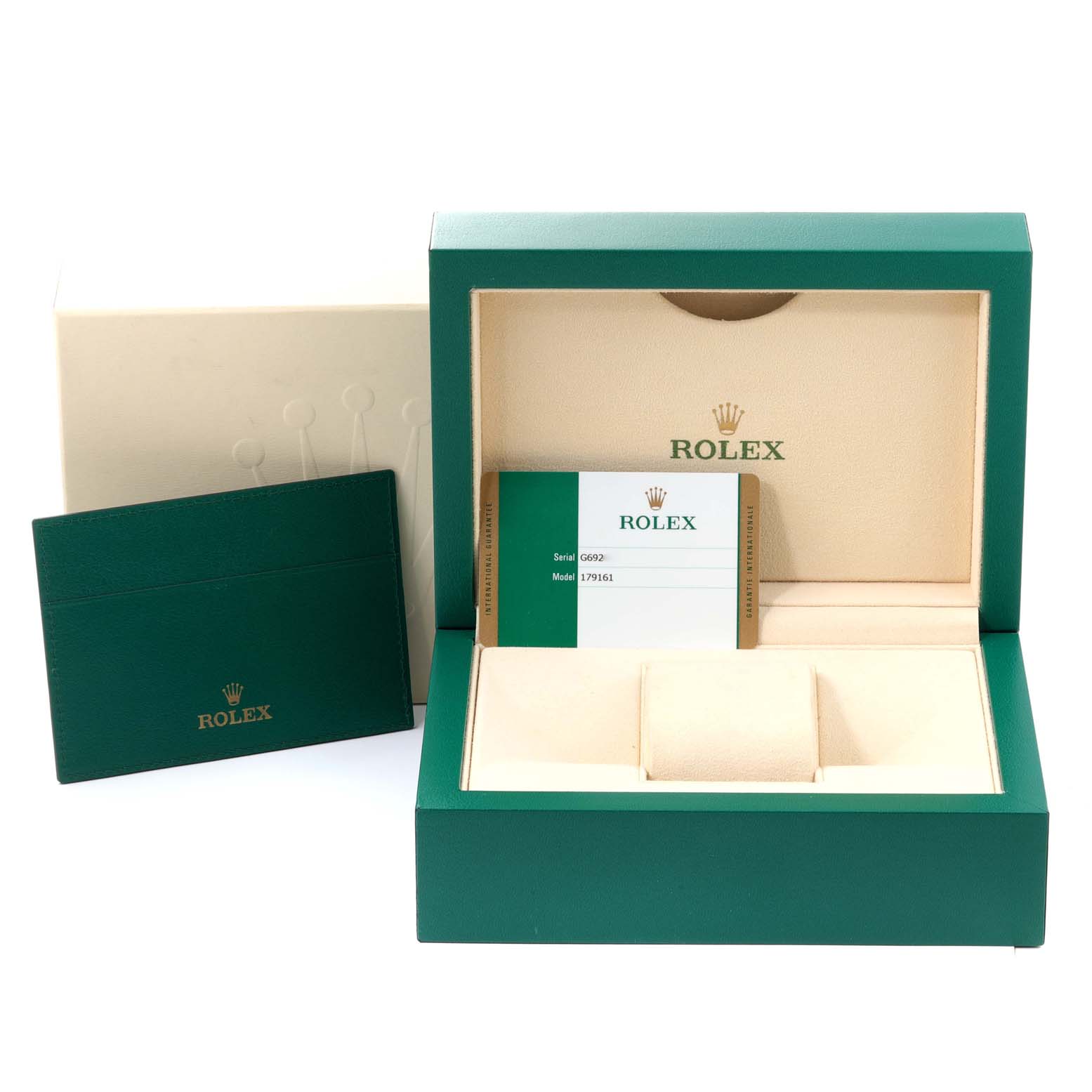 This image shows the packaging and a warranty card for the Rolex Datejust 179161 Women's Steel and Gold (two tone) Black Dial 179161 Women's Steel and Gold (two tone) Black Dial model.