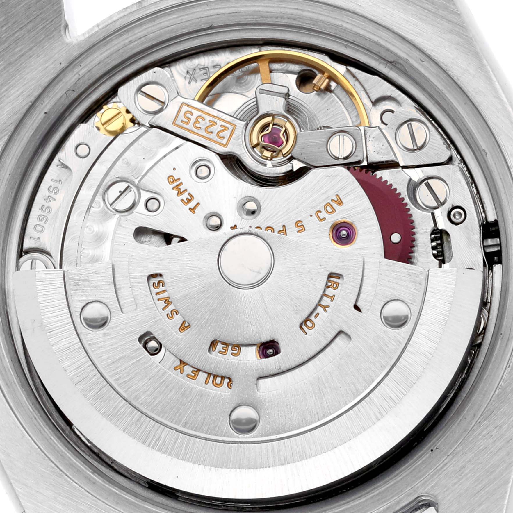 The image shows a close-up of the movement inside the Rolex Datejust 179174 Women's Stainless Steel Blue Dial 179174 Women's Stainless Steel Blue Dial, highlighting gears and the rotor.