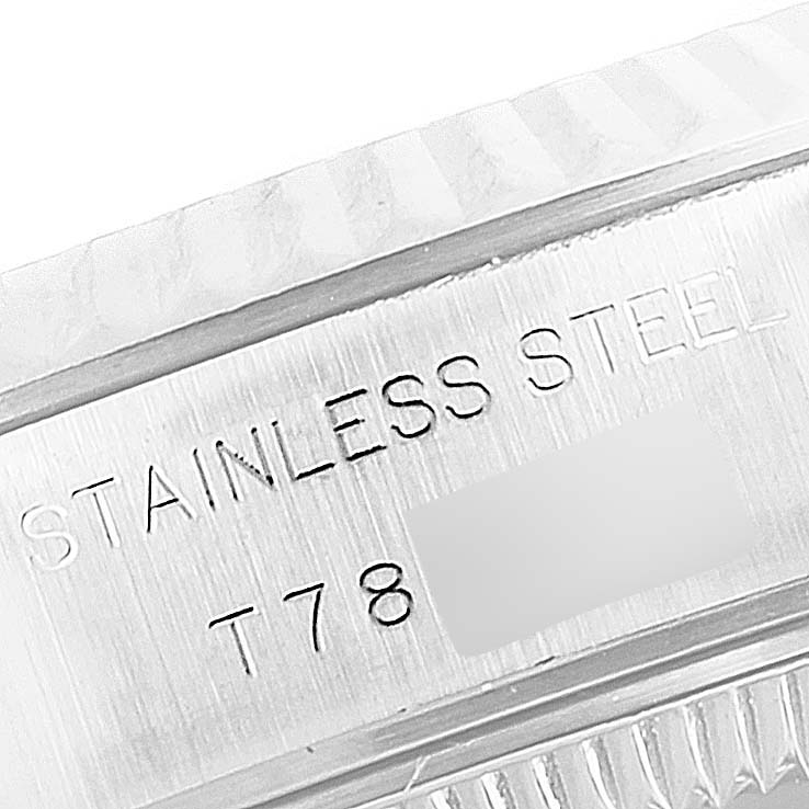 This is a close-up shot of the engraved bezel and case back of the Rolex Datejust 69174 Women's Stainless Steel Silver Dial 69174 Women's Stainless Steel Silver Dial wristwatch.