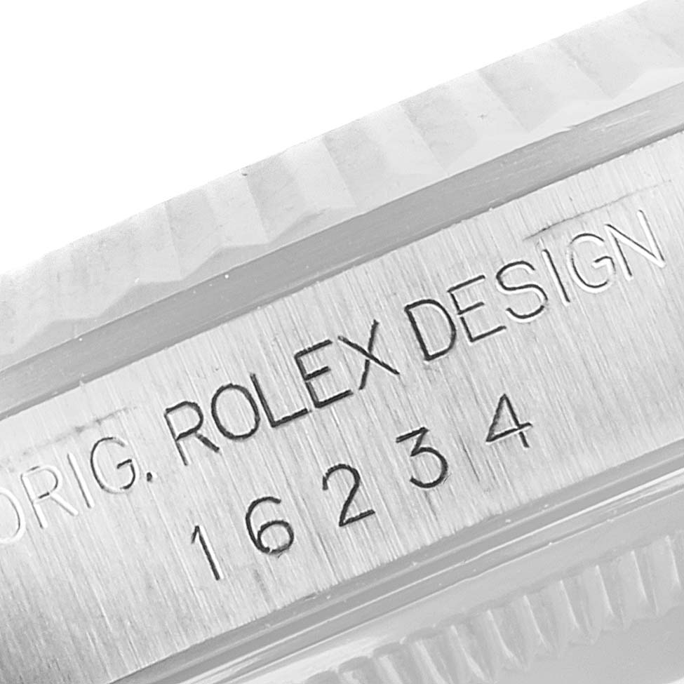 This image shows a close-up angle of the case side of a Rolex Datejust 16234 Men
s Stainless Steel Mother of Pearl Dial 16234 Men
s Stainless Steel Mother of Pearl Dial watch, displaying the model number and engraving.