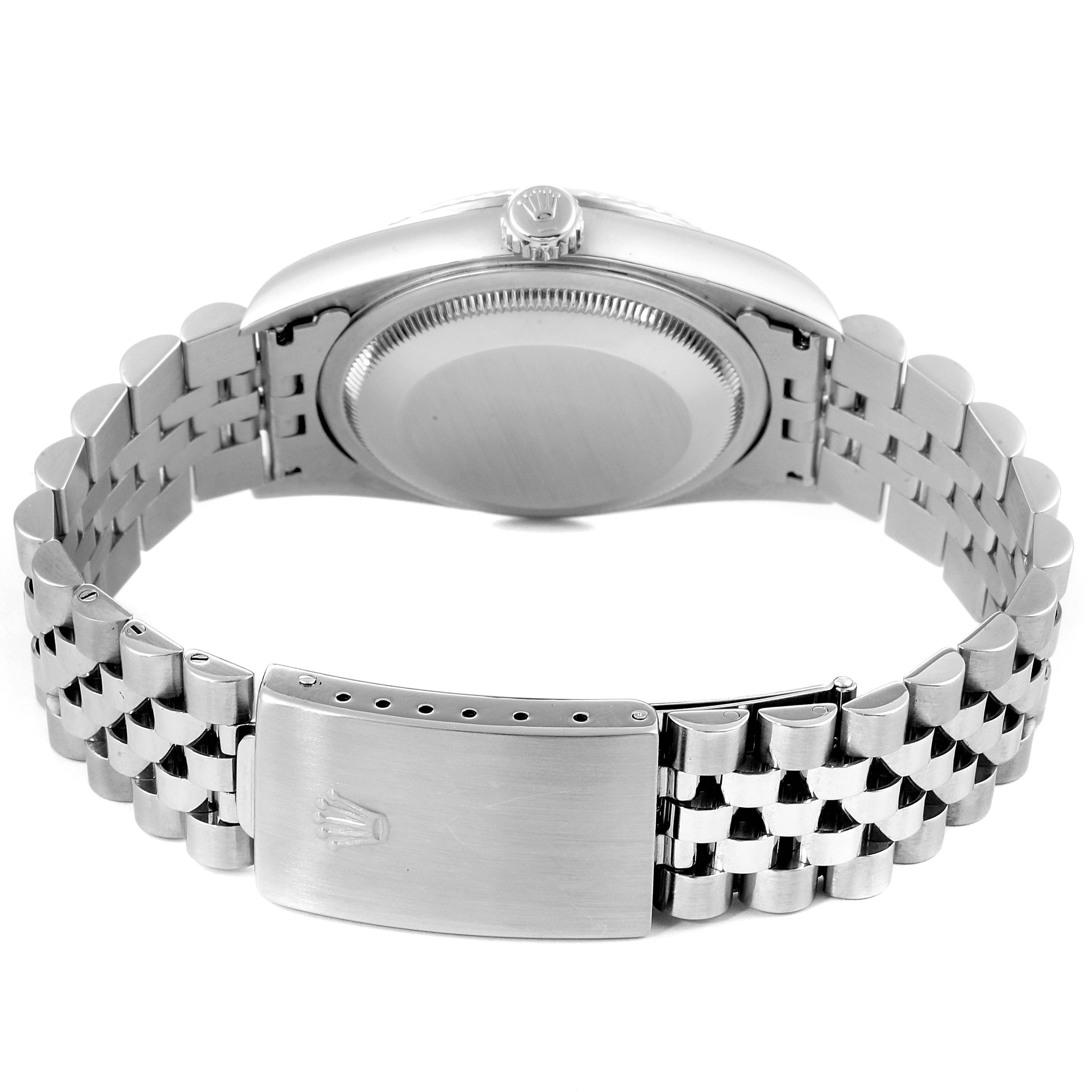 This Rolex Datejust 16234 Men
s Stainless Steel Mother of Pearl Dial 16234 Men
s Stainless Steel Mother of Pearl Dial watch is shown from the back, highlighting the case back, crown, and bracelet clasp.