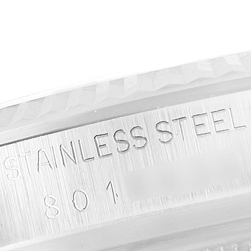 The image shows a close-up of the stainless steel casing with engraved details of the Vintage Collection model by Rolex.