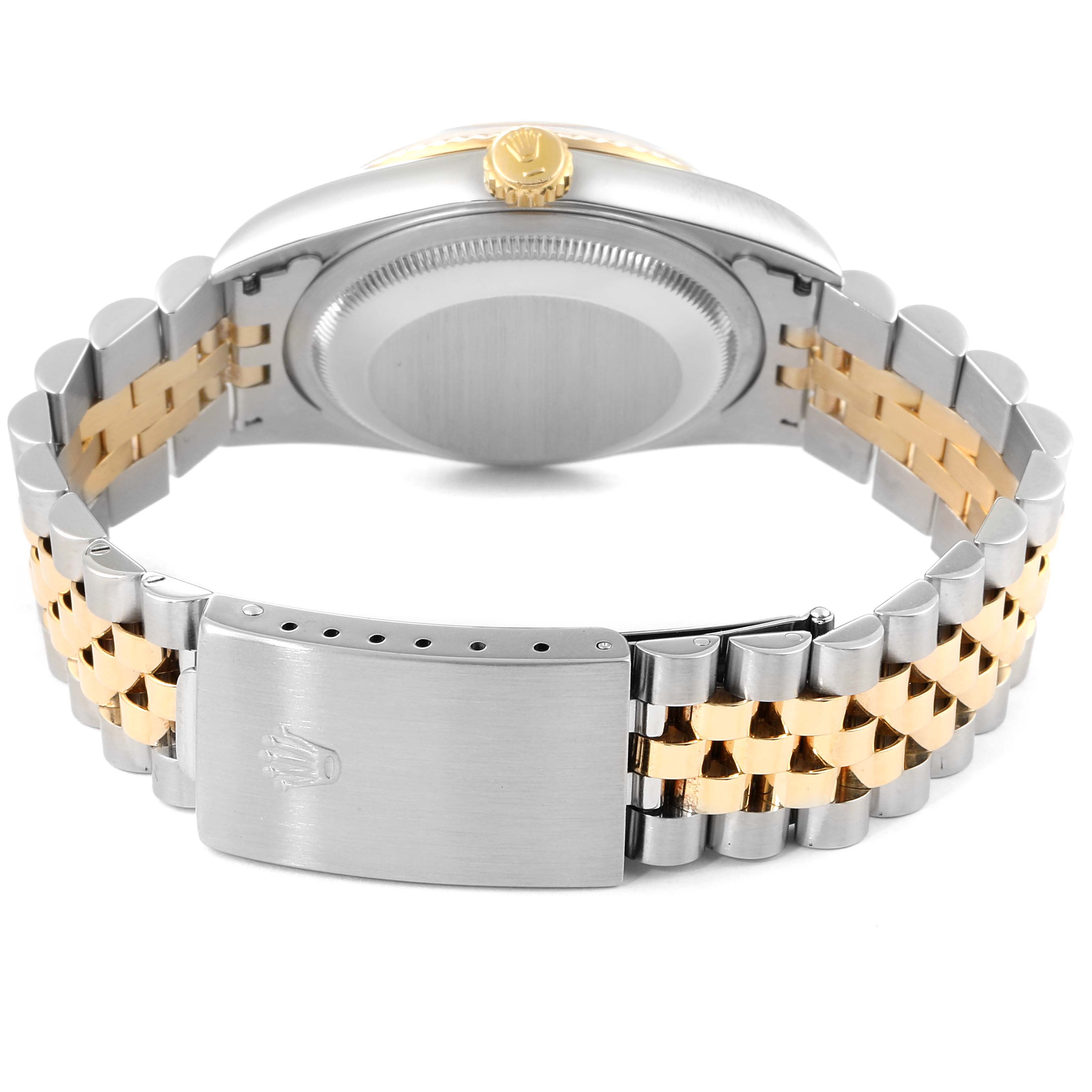 This image shows the back, crown, and bracelet clasp of a Rolex Datejust 16233 Men's Steel and Gold (two tone) Champagne Dial 16233 Men's Steel and Gold (two tone) Champagne Dial watch.