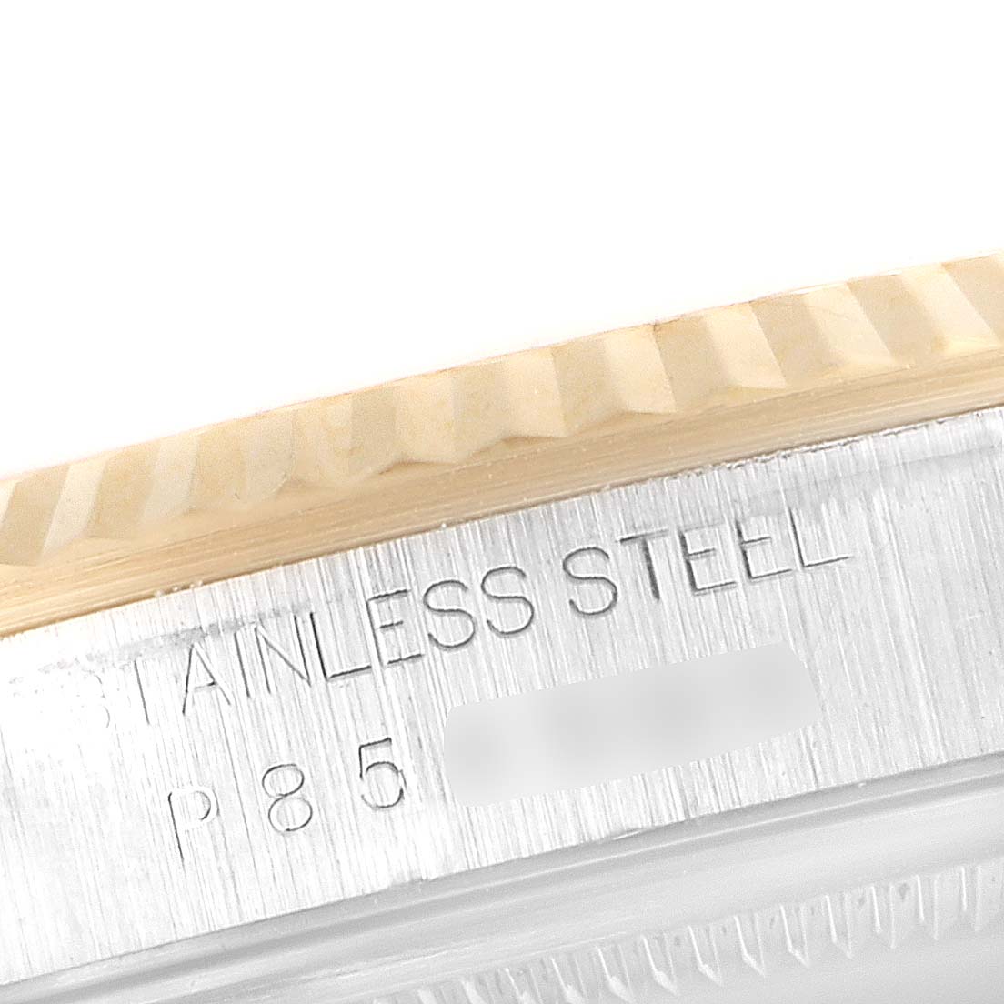 This image shows a close-up of the case side and fluted bezel with the engraved text of a Rolex Datejust 16233 Men's Steel and Gold (two tone) Blue Dial 16233 Men's Steel and Gold (two tone) Blue Dial watch.