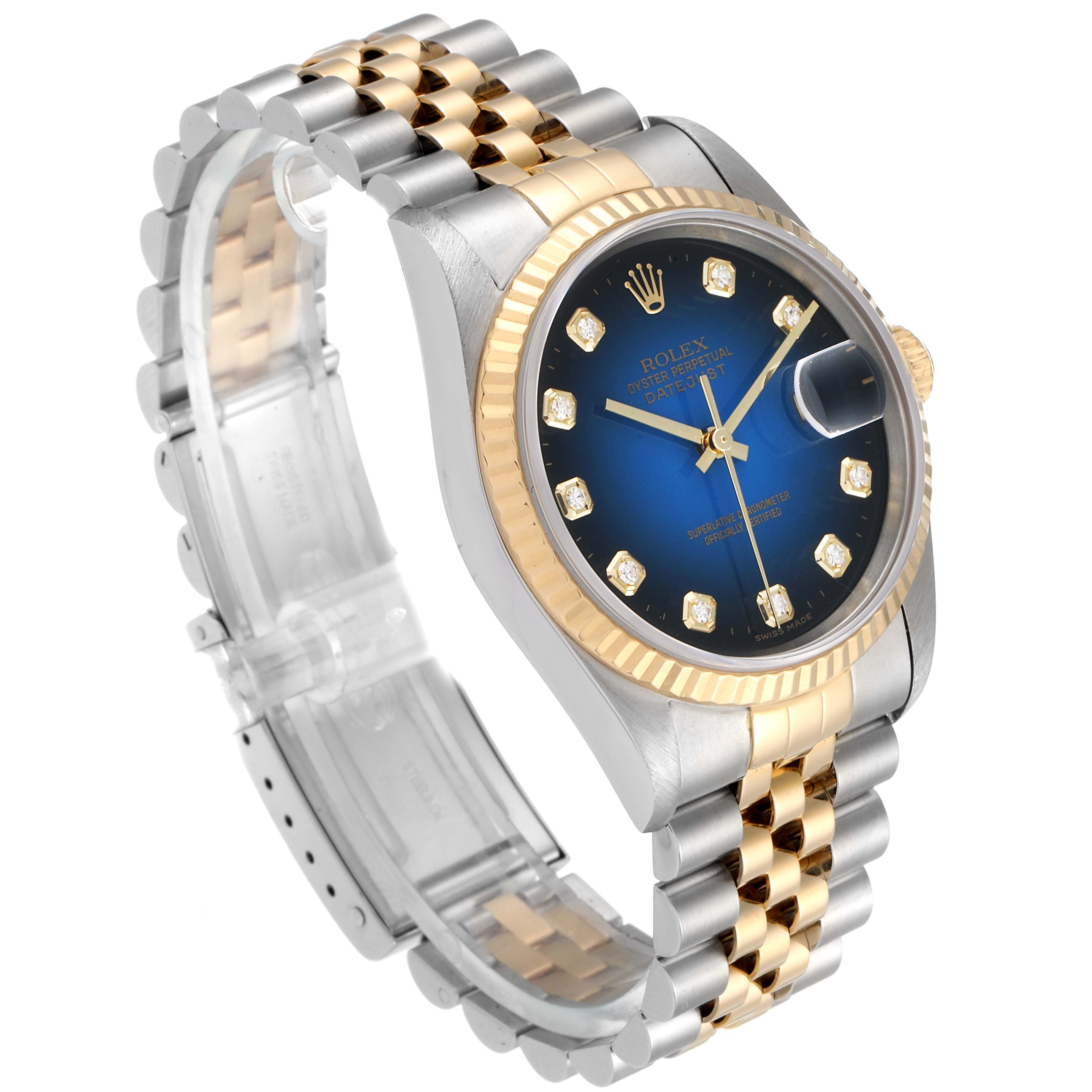 This image shows a Rolex Datejust 16233 Men's Steel and Gold (two tone) Blue Dial 16233 Men's Steel and Gold (two tone) Blue Dial watch at a slight angle, clearly displaying the dial, case, bracelet, and clasp.