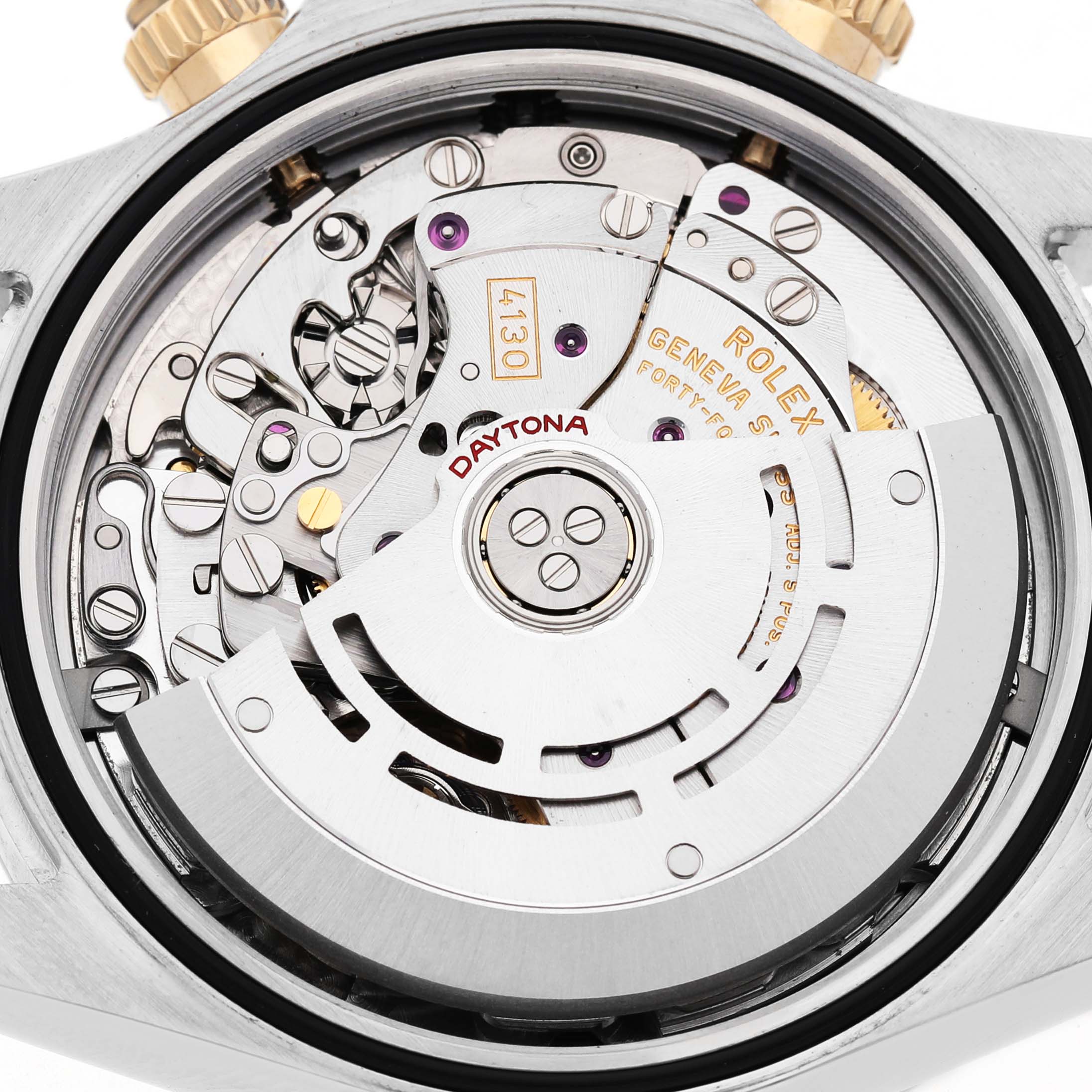 The image shows the internal mechanism of a Rolex Daytona 116523 Men's Steel and Gold (two tone) Black Dial watch, highlighting the rotor and movement components.