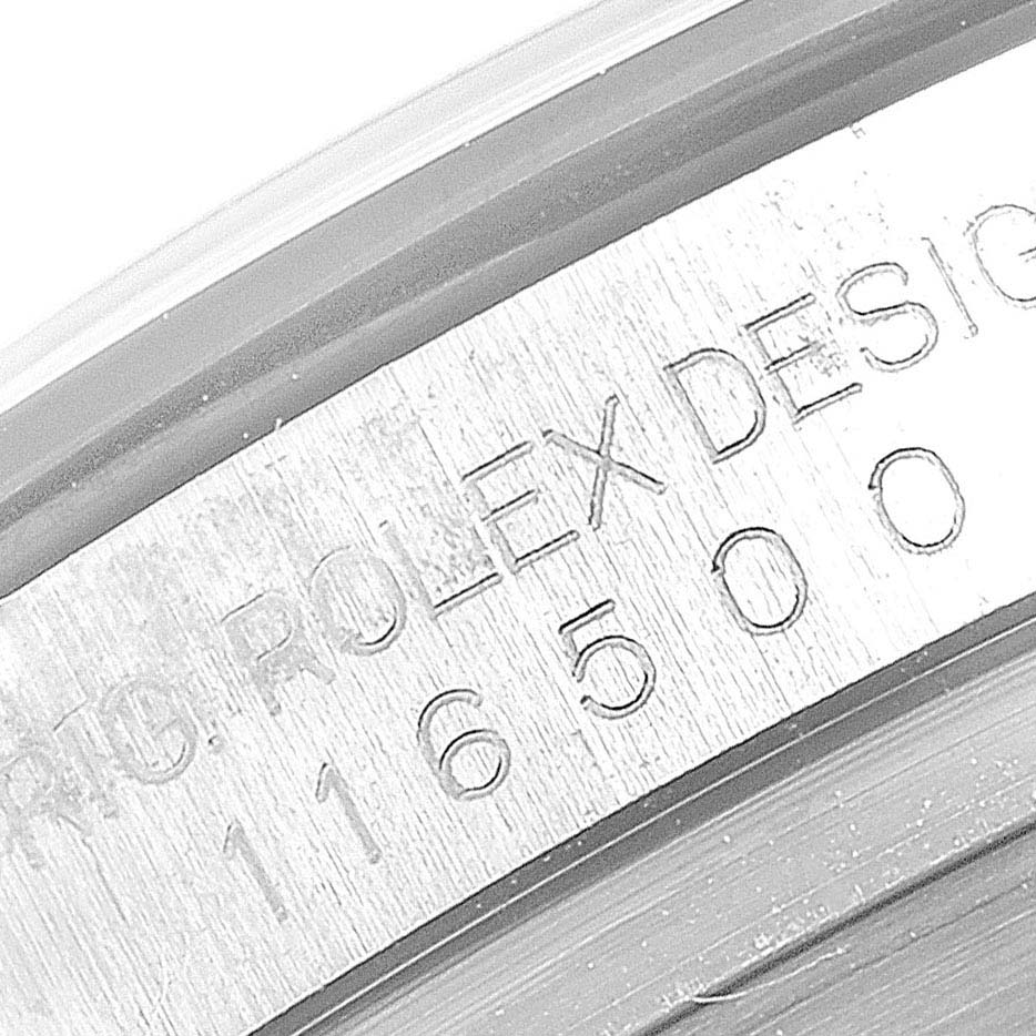 The image shows a close-up of the Rolex Daytona 116500 Men's Stainless Steel White Dial 116500 Men's Stainless Steel White Dial model's engraved serial number and brand name on the watch case.