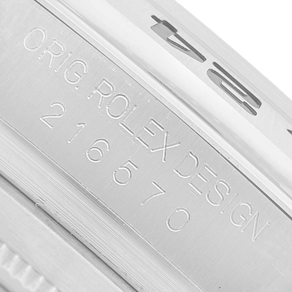 The image shows the side view of a Rolex Explorer 216570 Men's Stainless Steel White Dial watch, highlighting its engraved model number 216570 and "Orig Rolex Design."