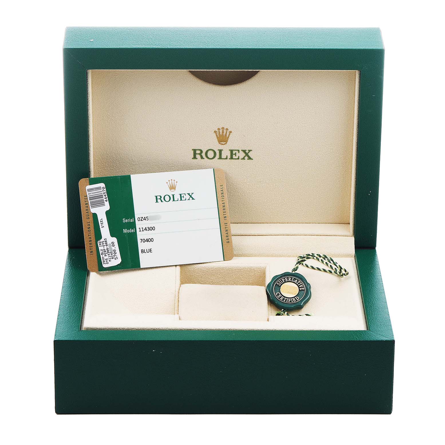 The image shows a Rolex Oyster Perpetual 114300 Men's Stainless Steel Blue Dial watch box with a warranty card and certification tag inside.