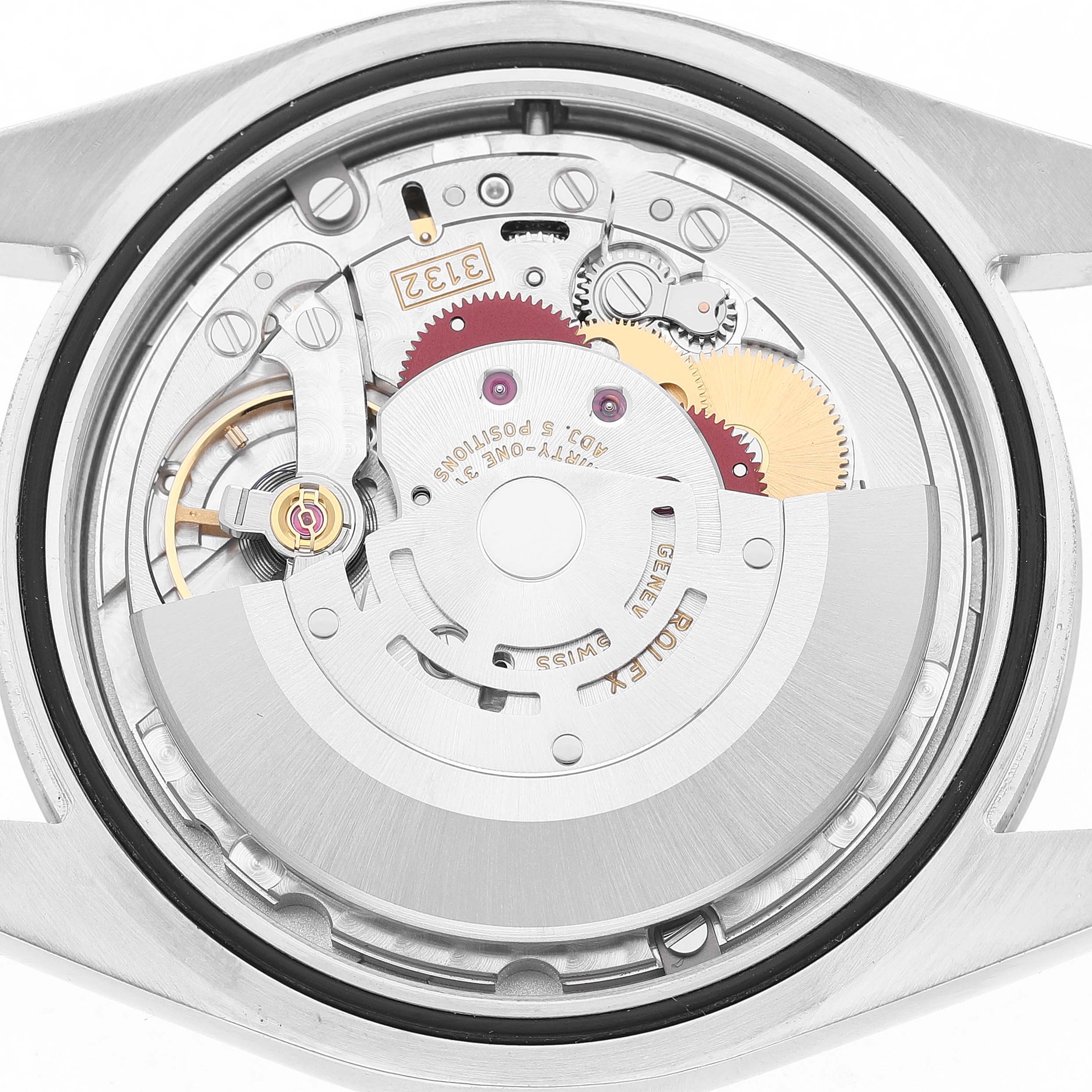 The image shows the movement mechanism of a Rolex Oyster Perpetual 114300 Men's Stainless Steel Blue Dial watch from the back, highlighting gears and intricate components.